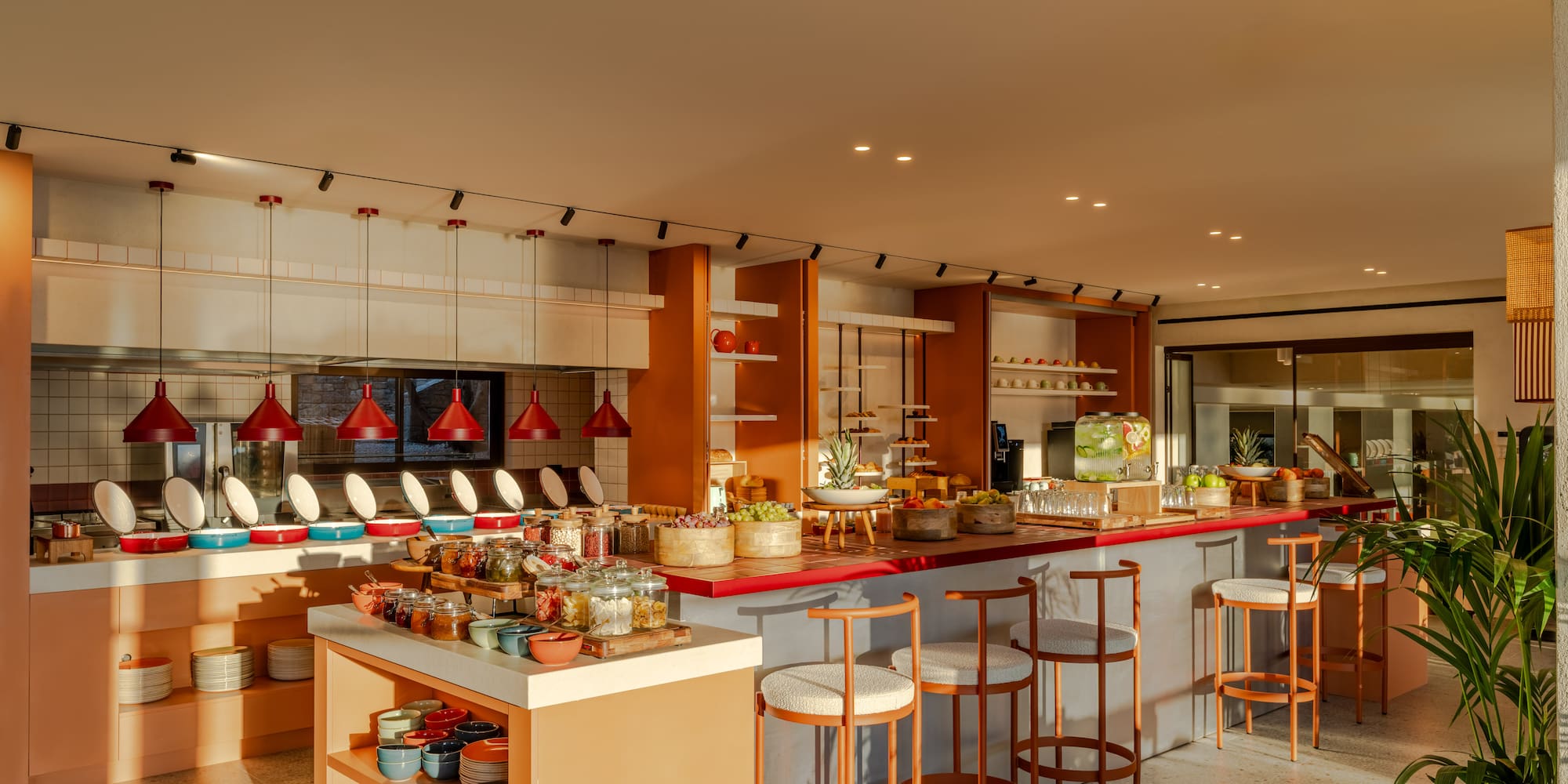 a kitchen with a counter and stools