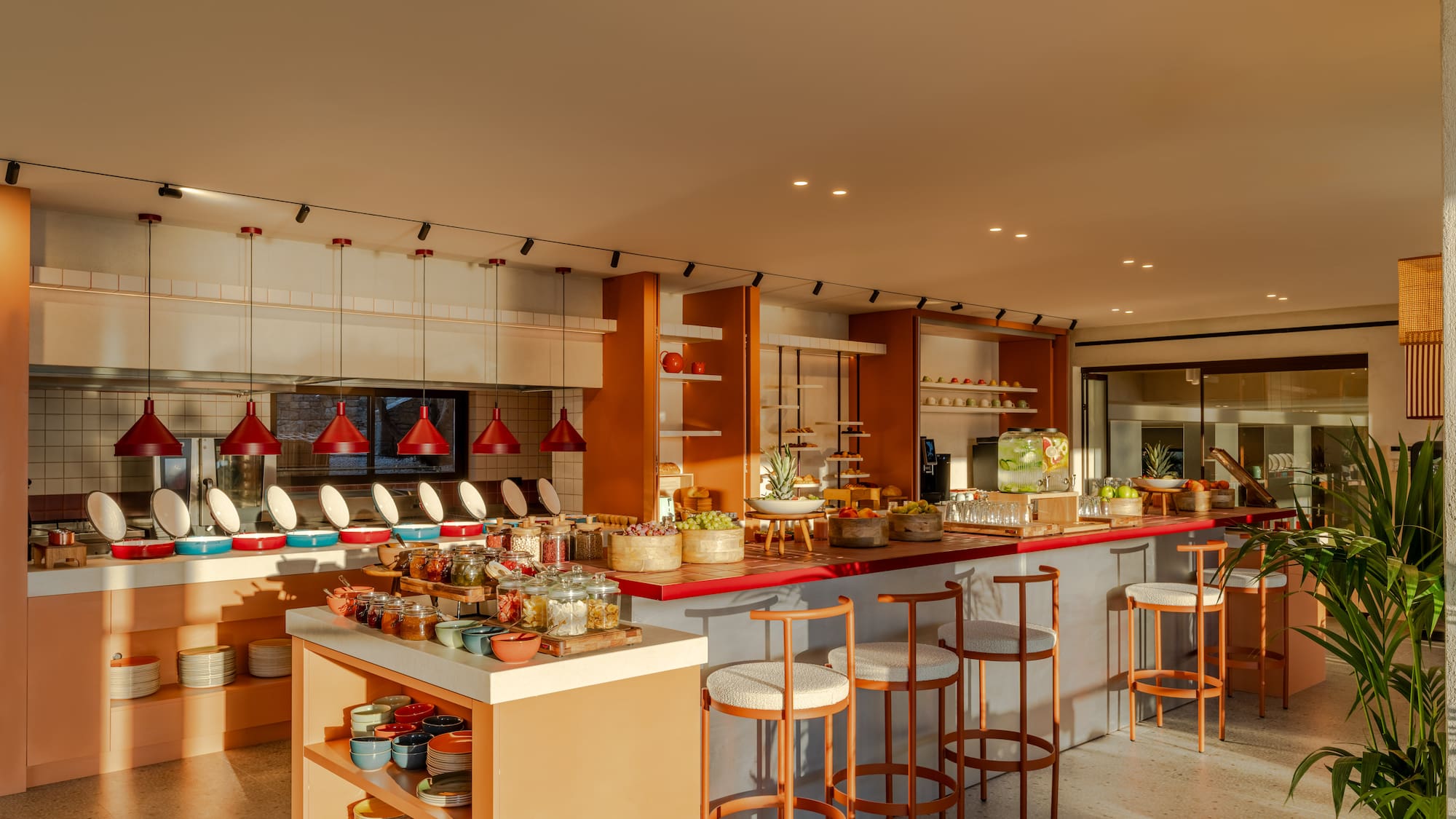 a kitchen with a counter and stools