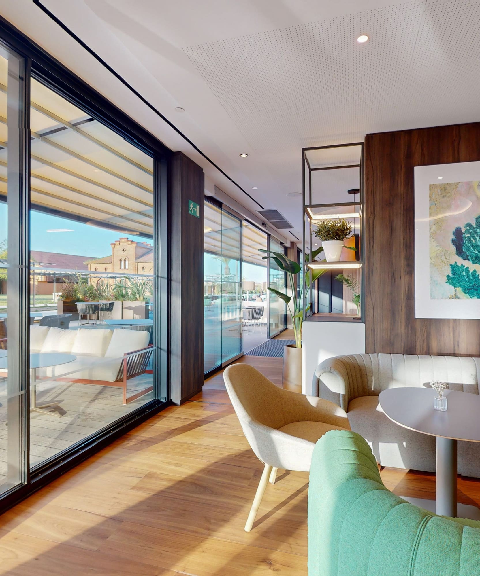 a room with a couch and chairs