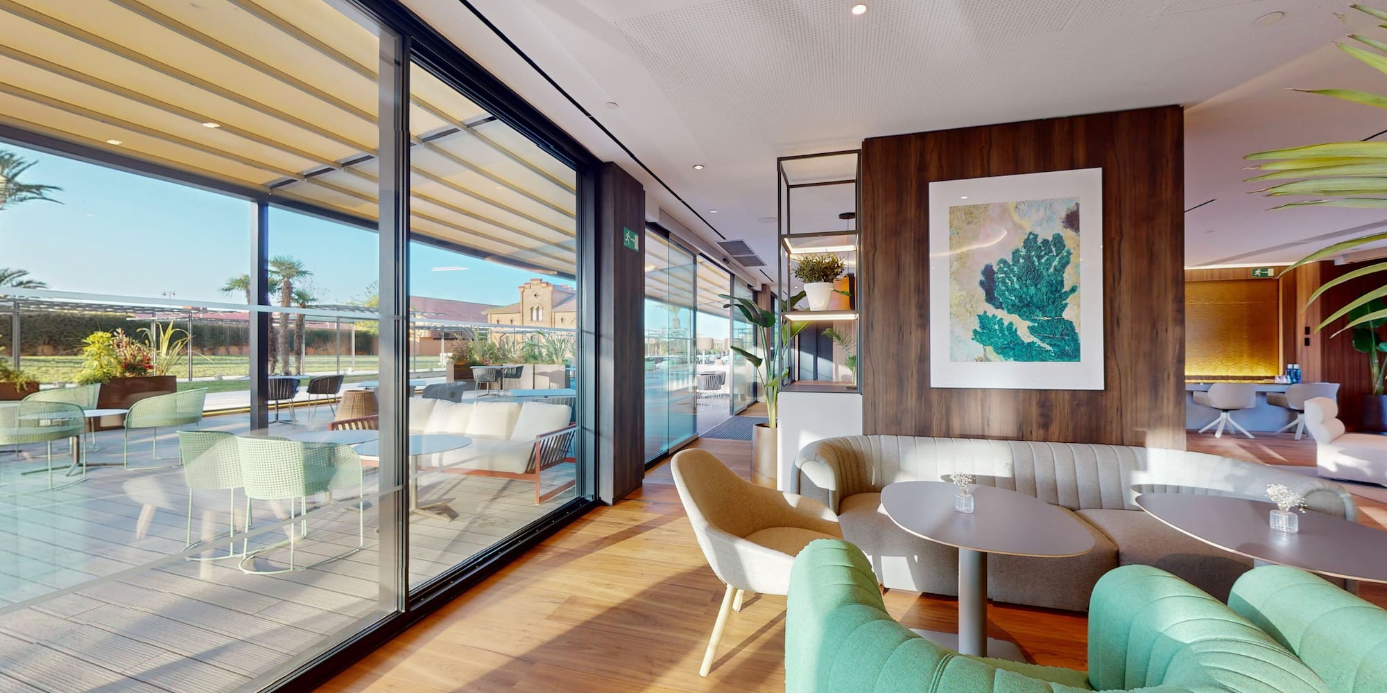 a room with a couch and chairs