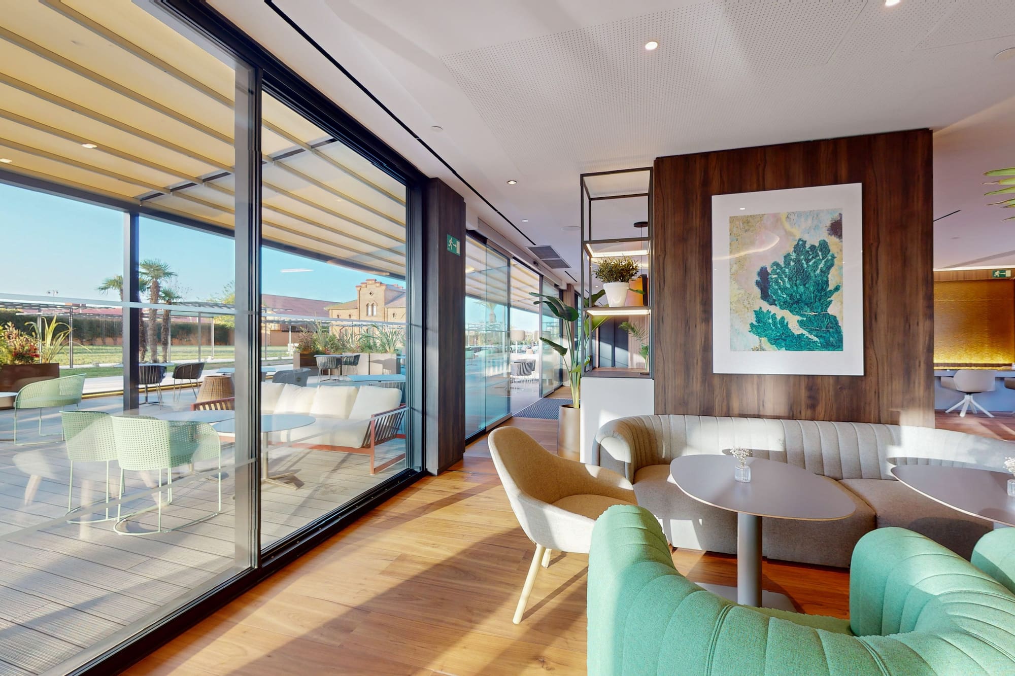 a room with a couch and chairs