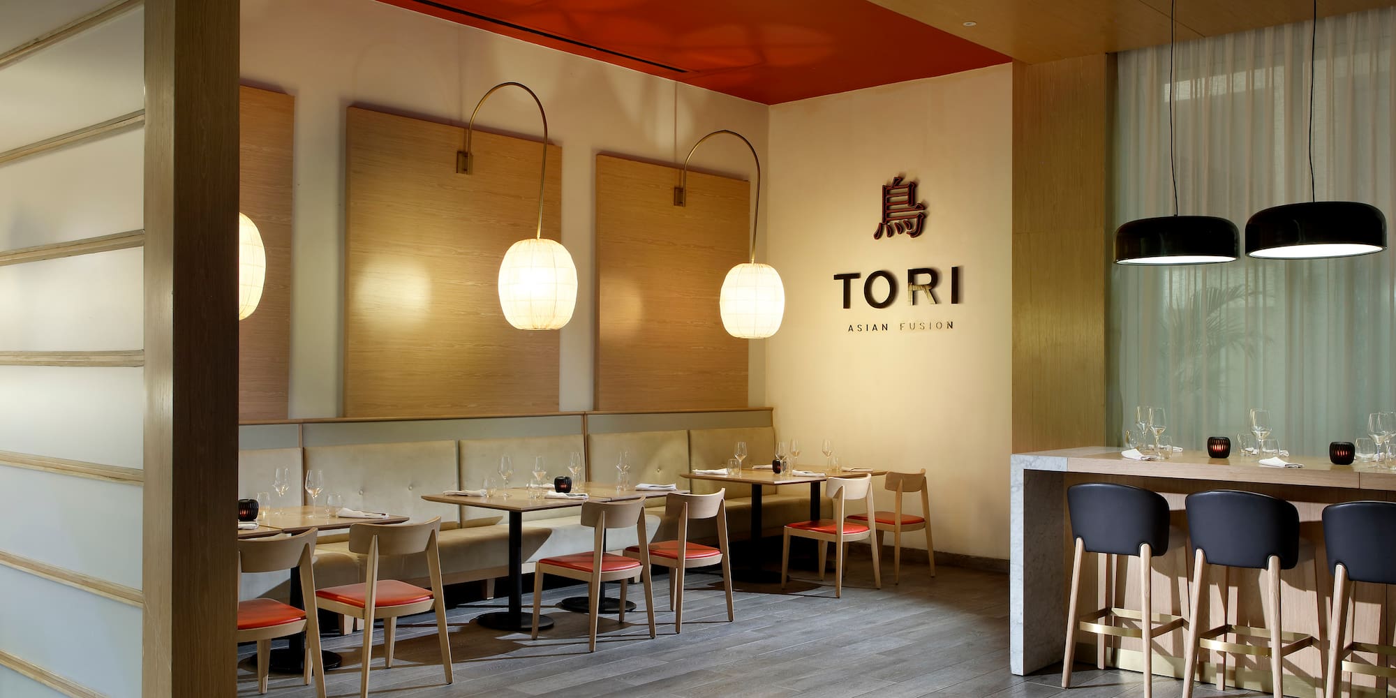 a restaurant with tables and chairs