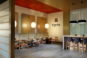 a restaurant with tables and chairs