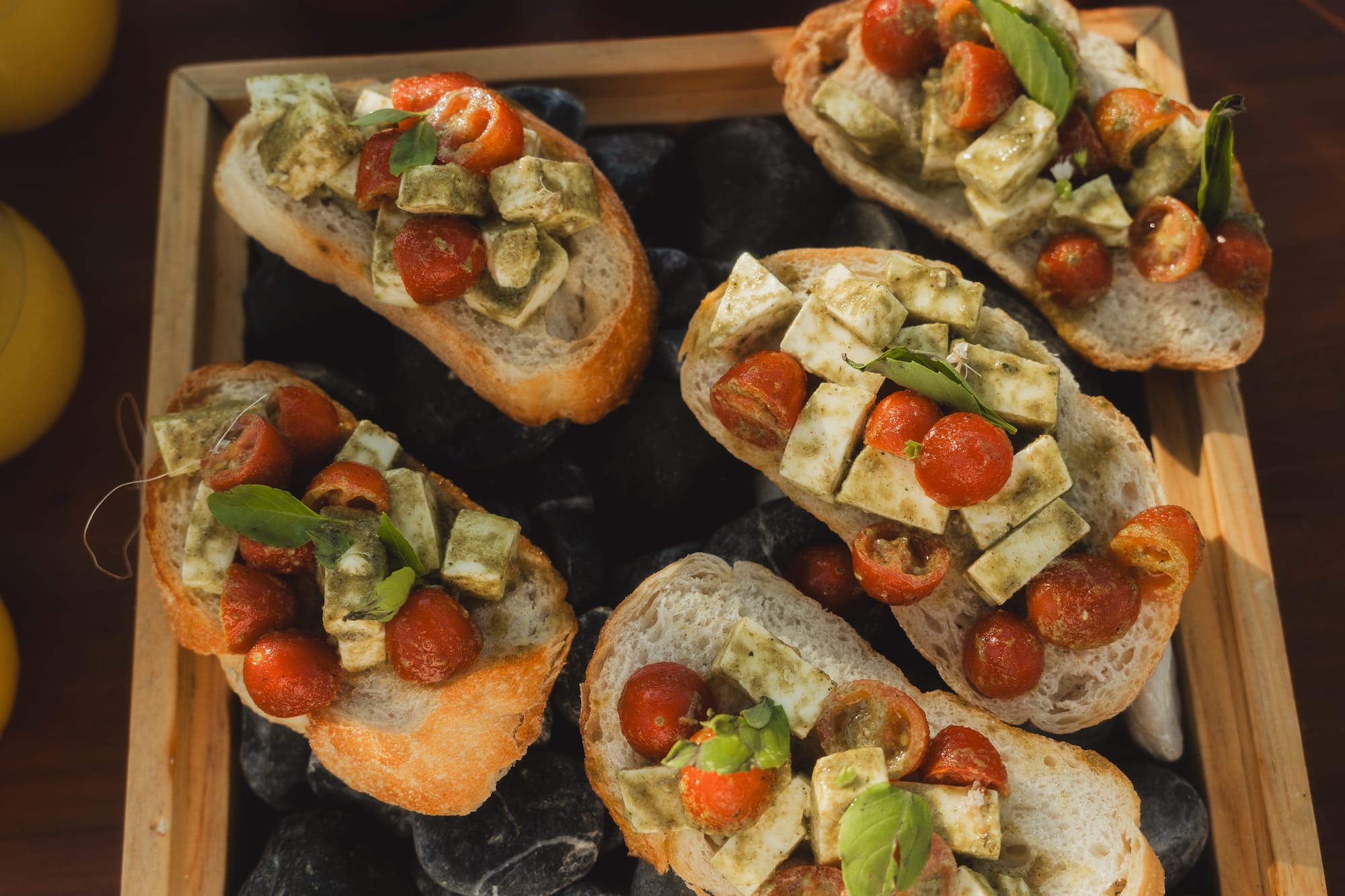 a group of sandwiches with tomatoes and cheese