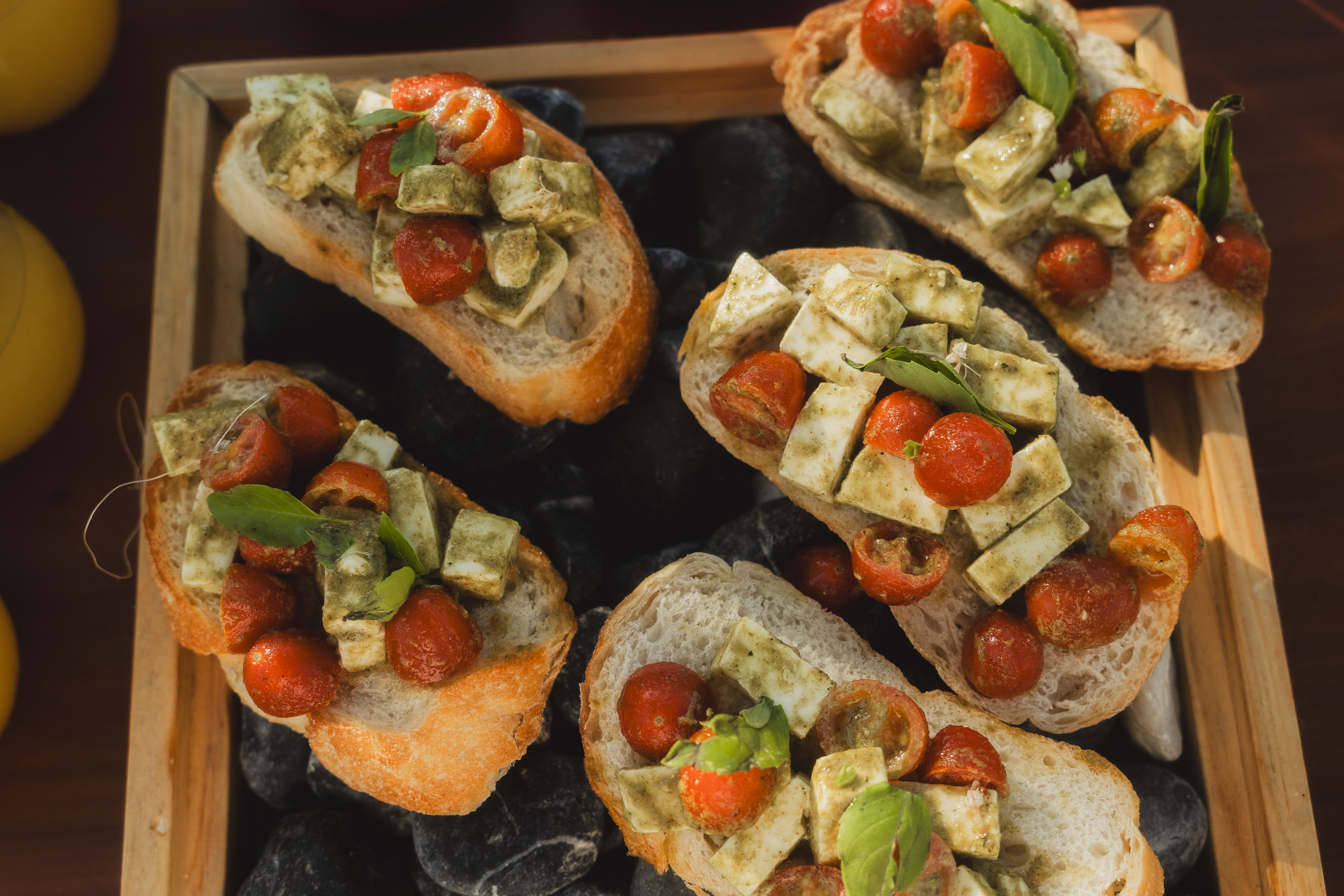 a group of sandwiches with tomatoes and cheese