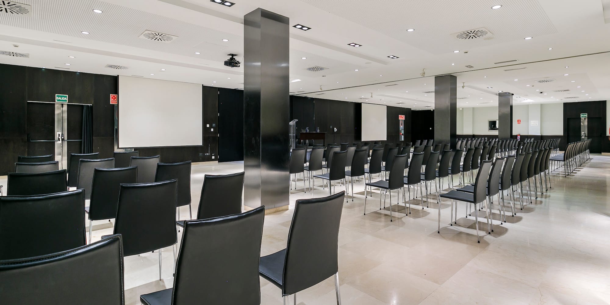 a room with black chairs