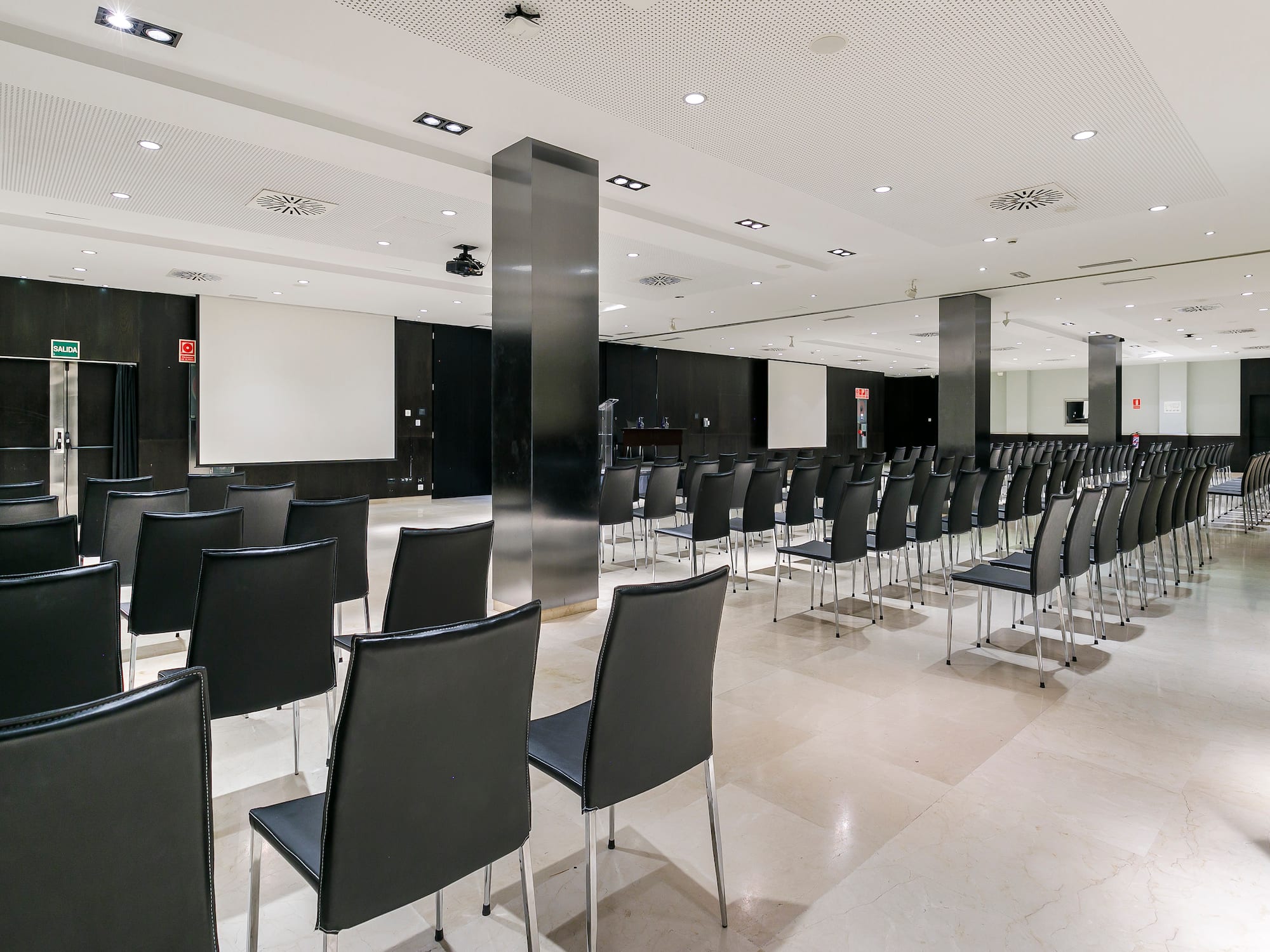 a room with black chairs