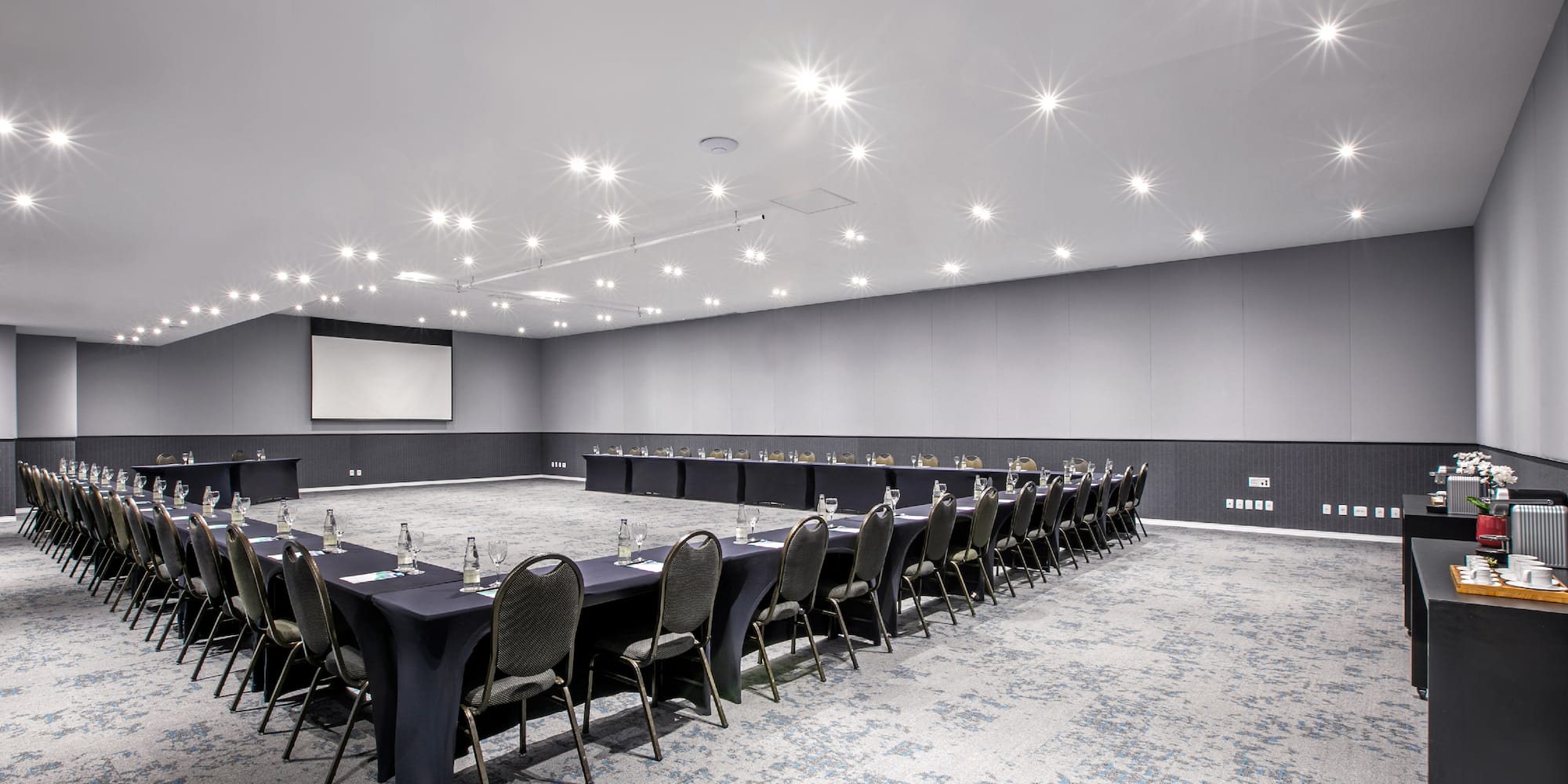 a room with a large table and chairs