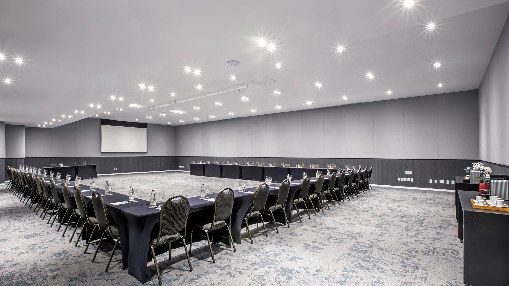 a room with a large table and chairs