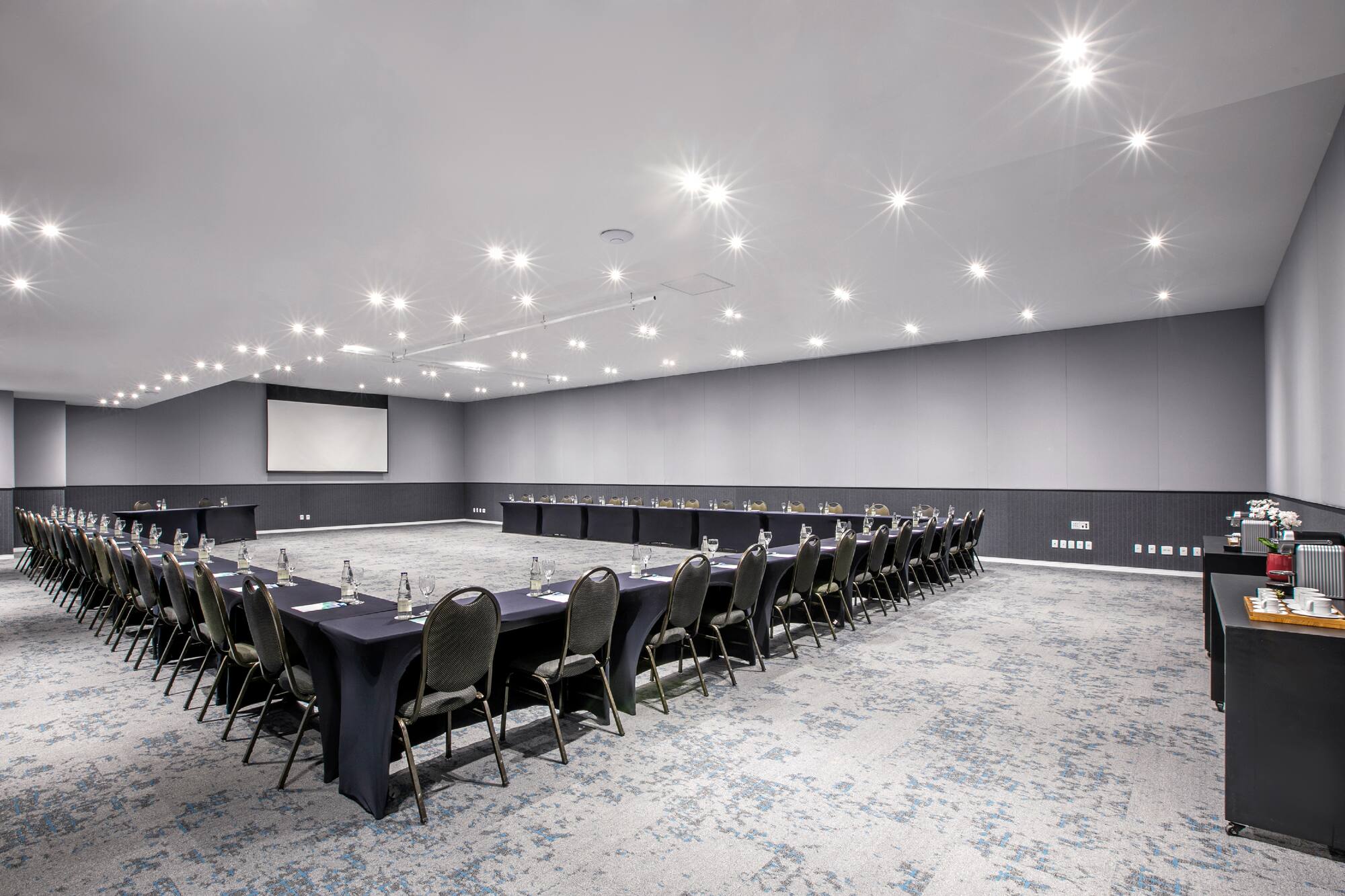 a room with a large table and chairs