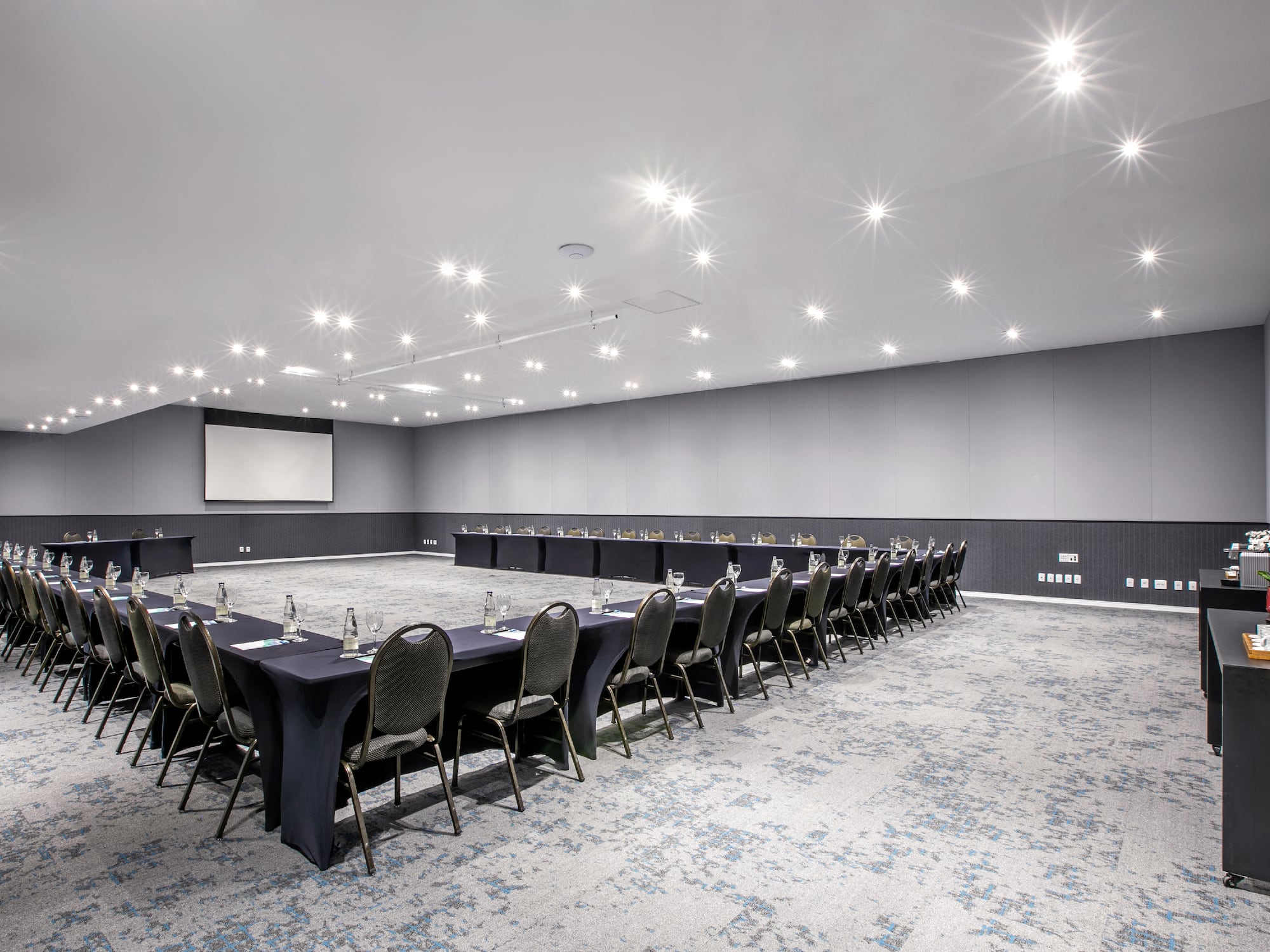 a room with a large table and chairs