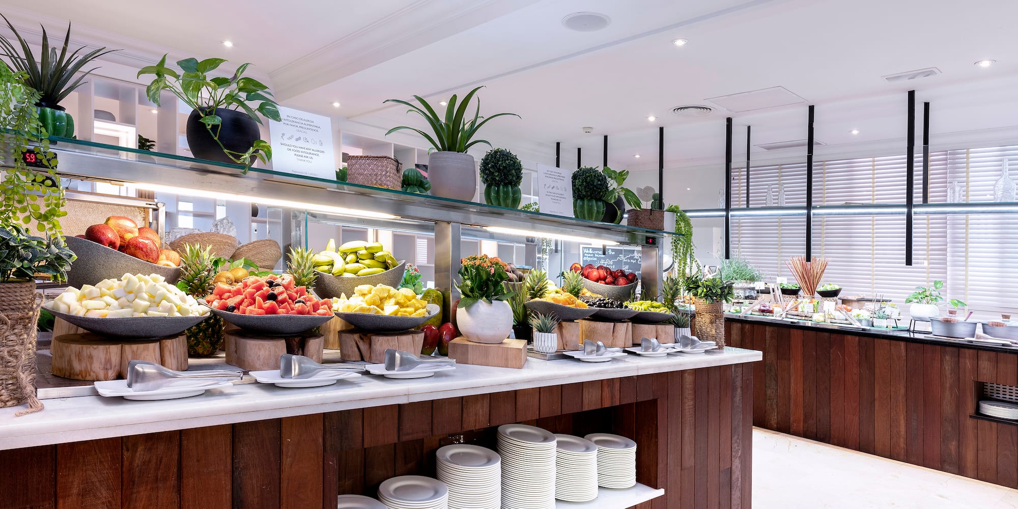 Fresh fruit and healthy breakfast buffet in a hotel restaurant.