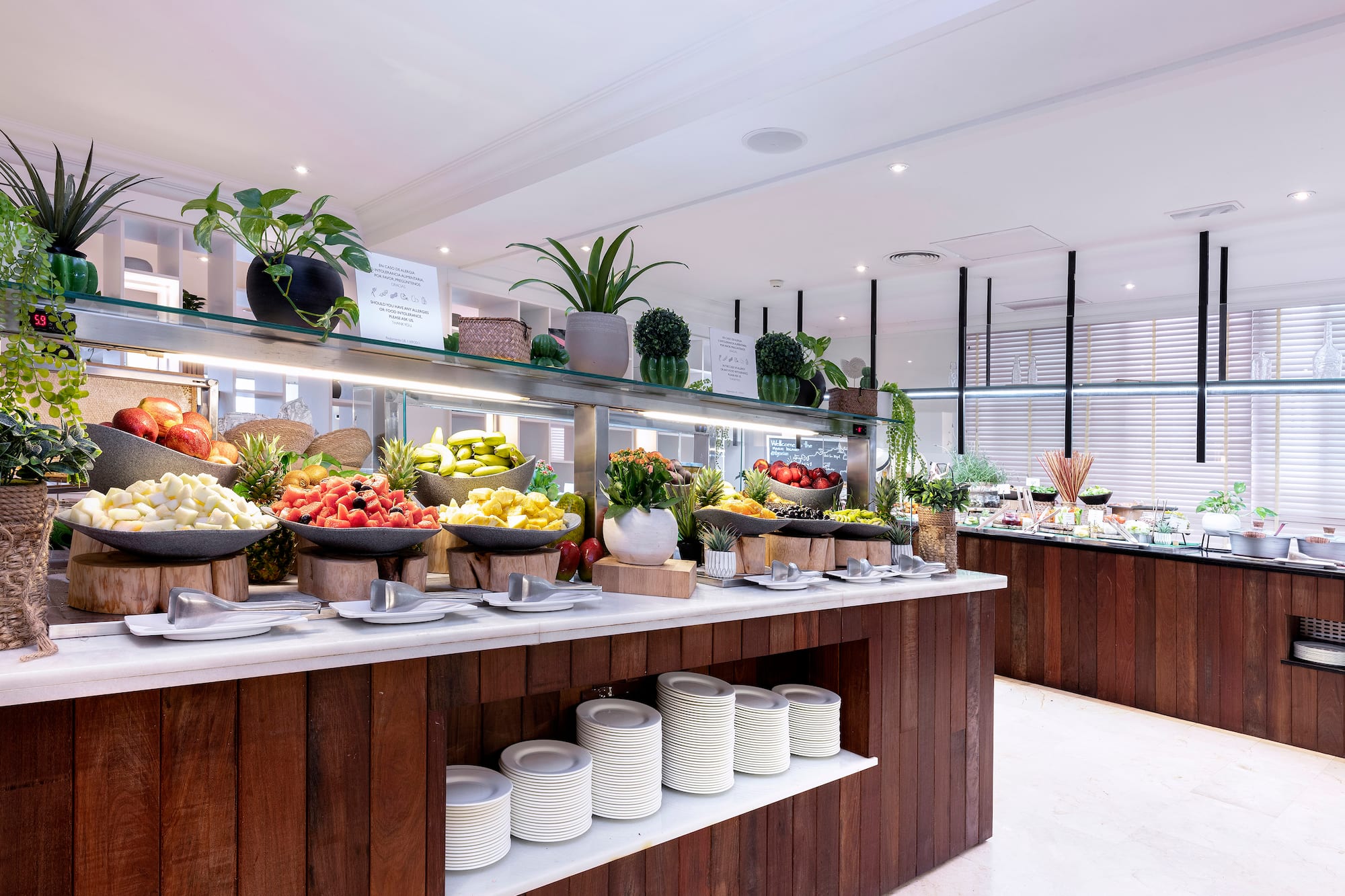 Fresh fruit and healthy breakfast buffet in a hotel restaurant.