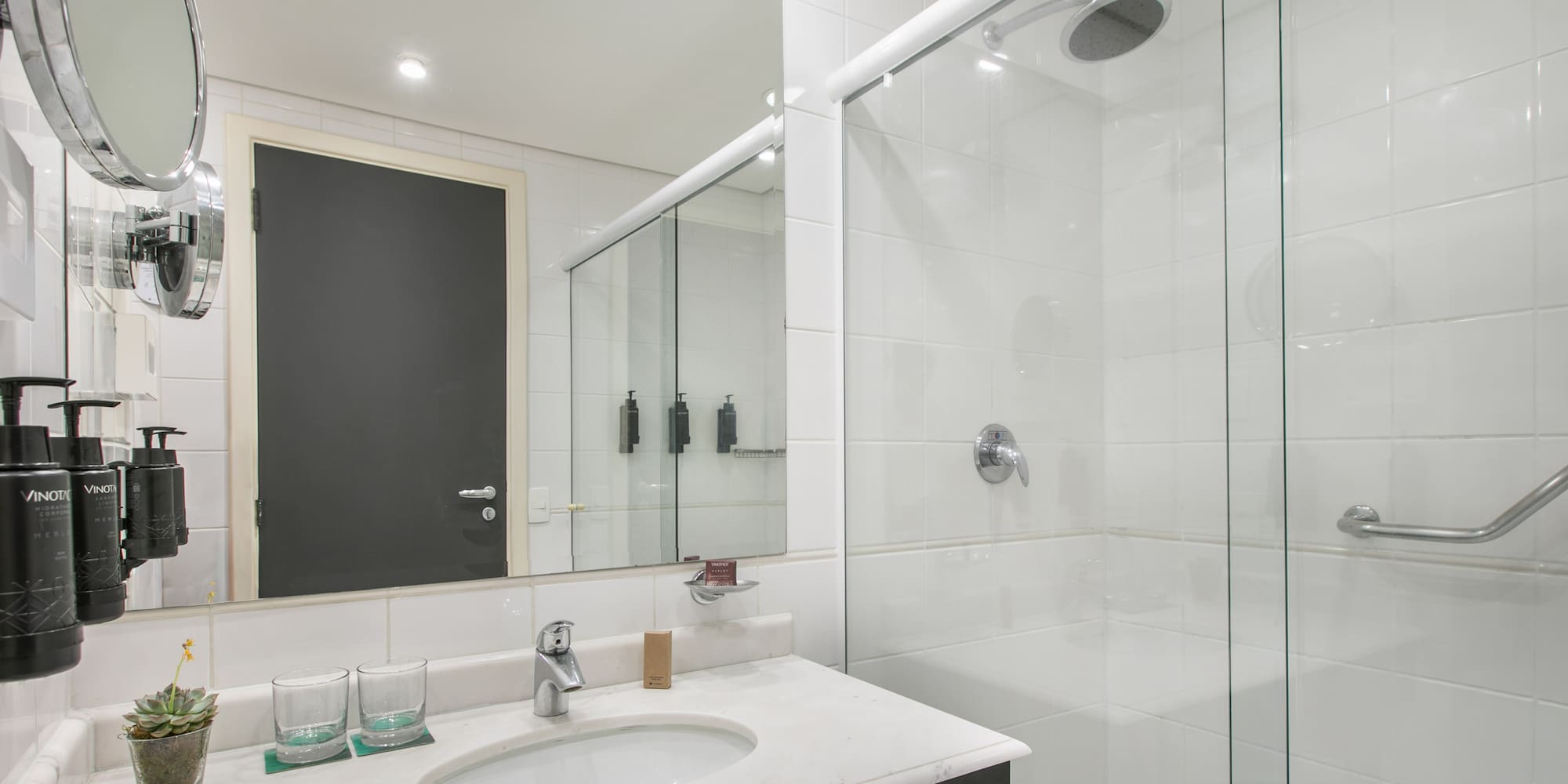 a bathroom with a shower and sink