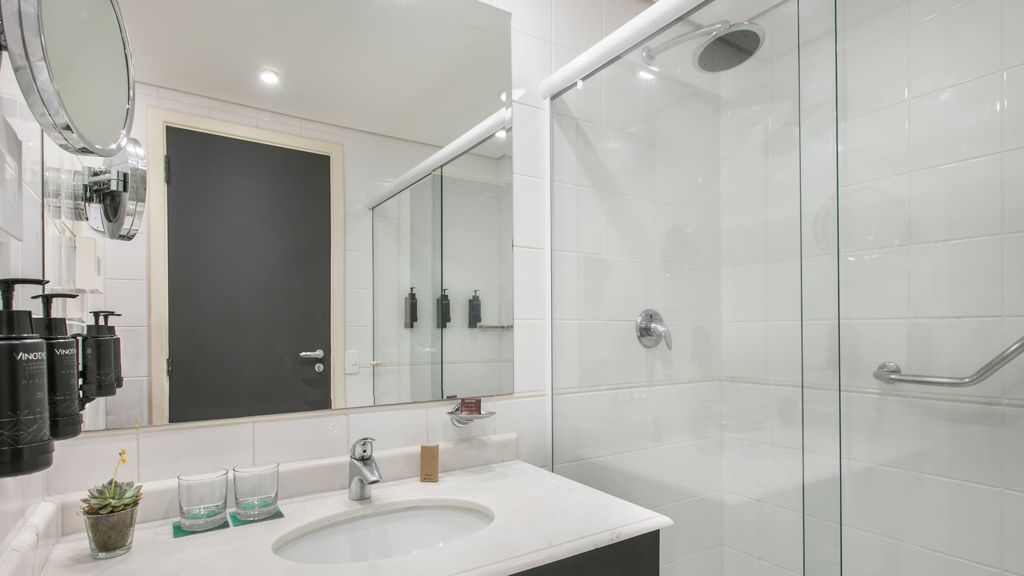 a bathroom with a shower and sink