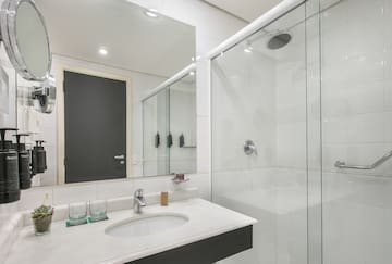 a bathroom with a shower and sink