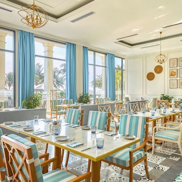 a room with tables and chairs