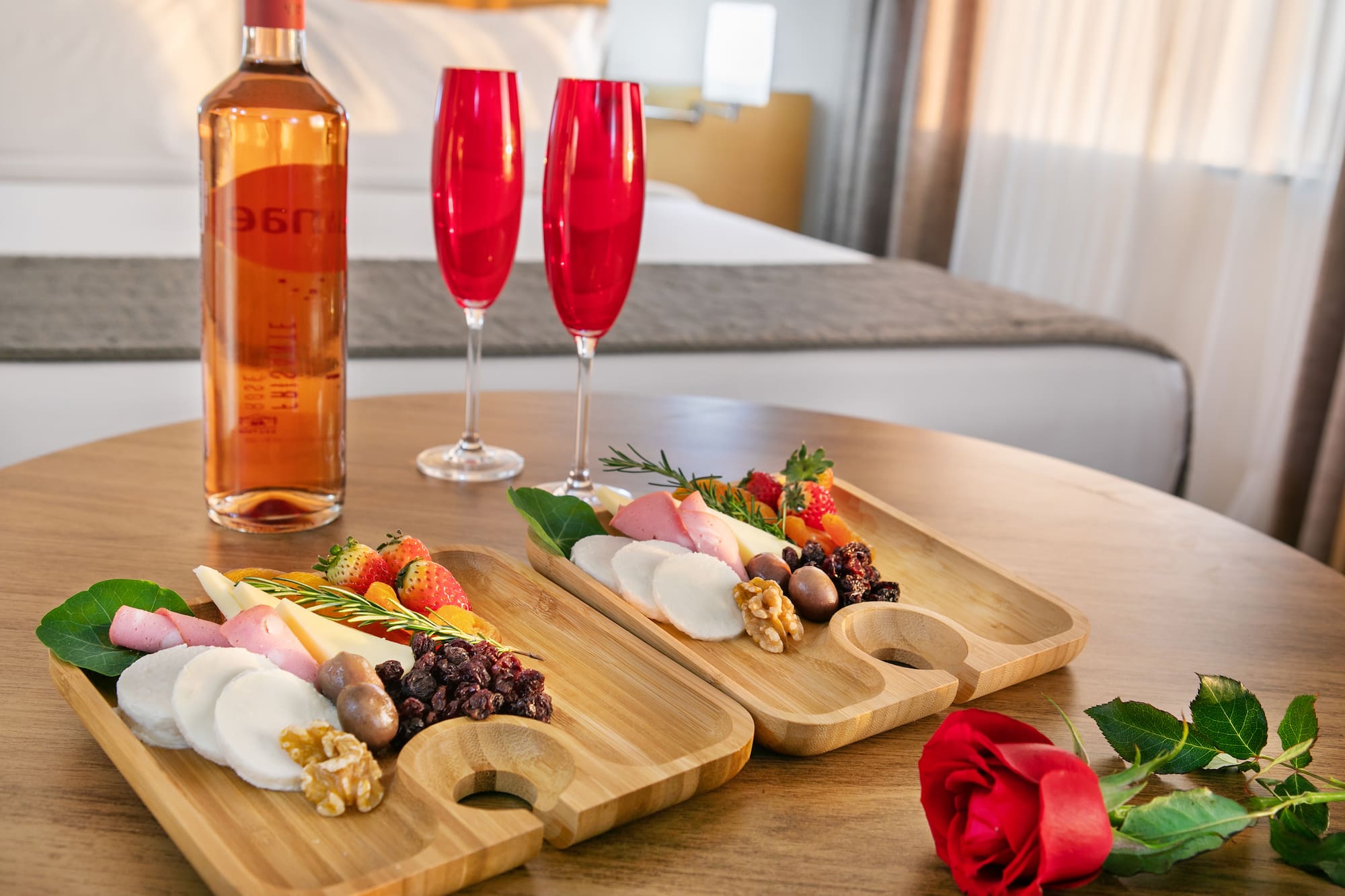 a couple of wooden plates with food on a table