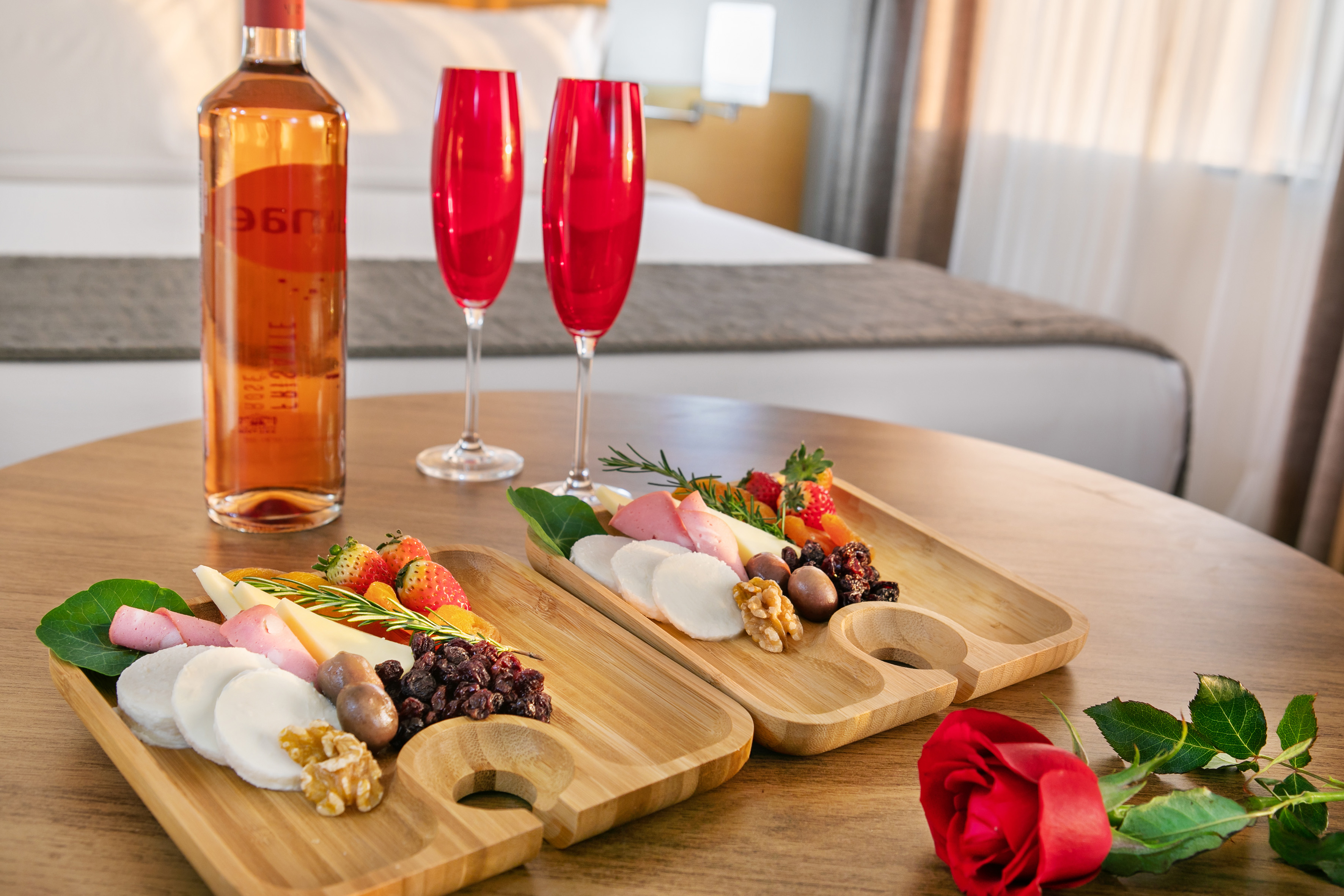 a couple of wooden plates with food on a table