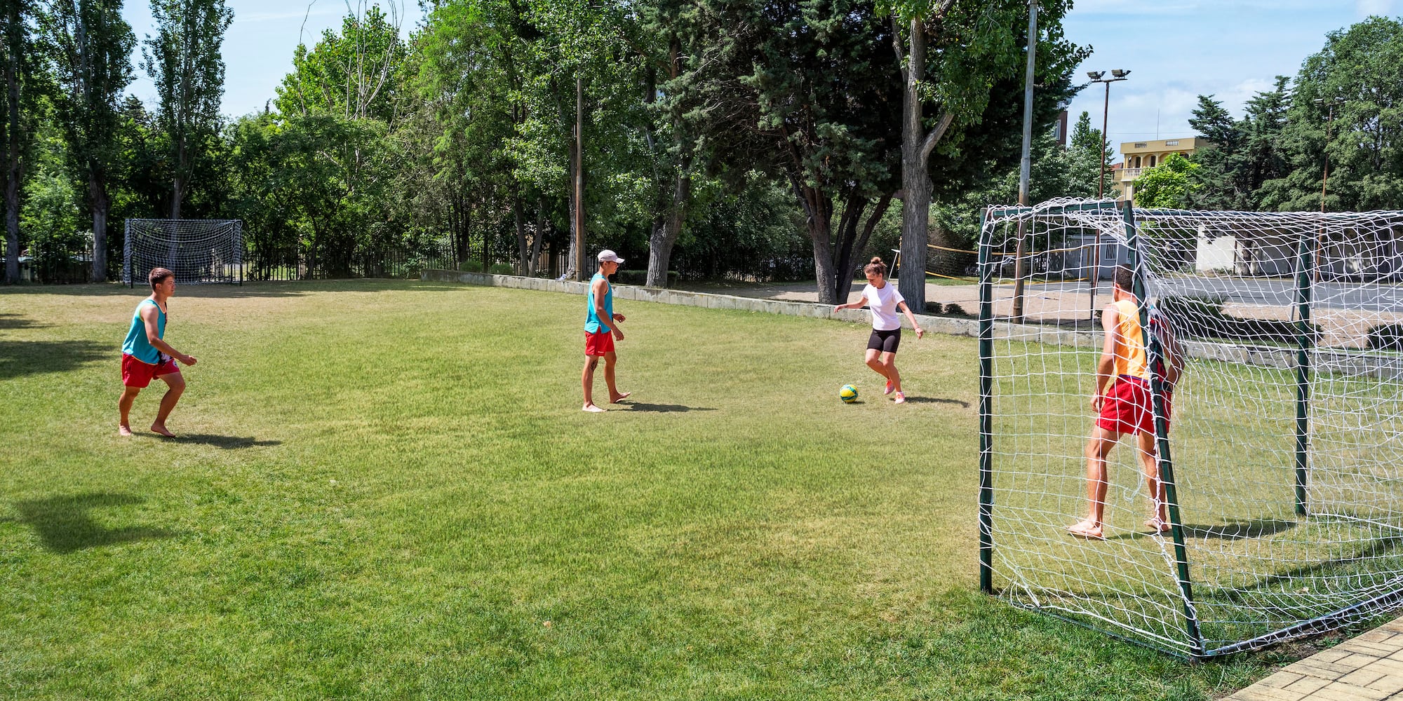 a group of kids playing football