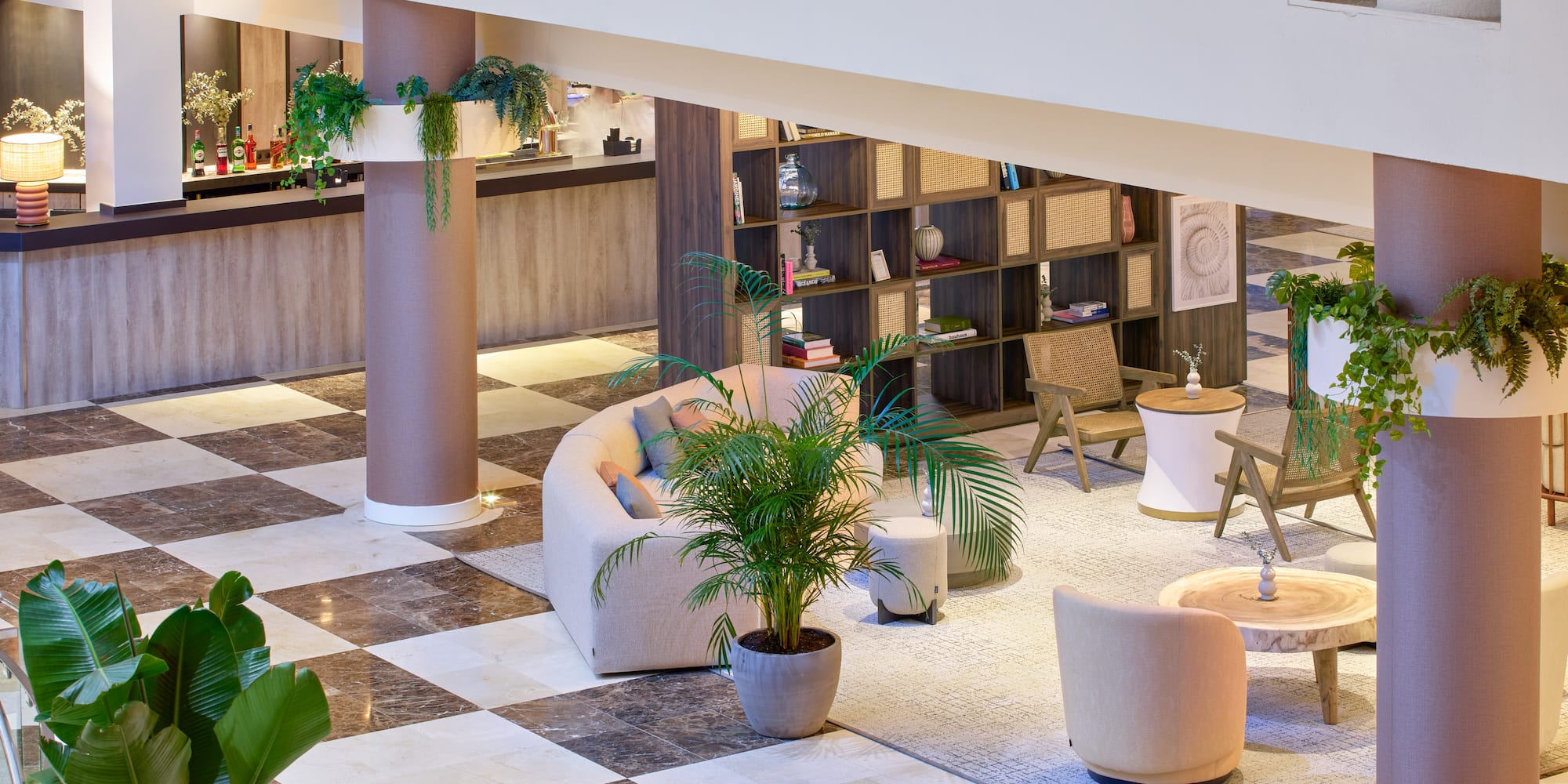 a room with a checkered floor and a couch and tables
