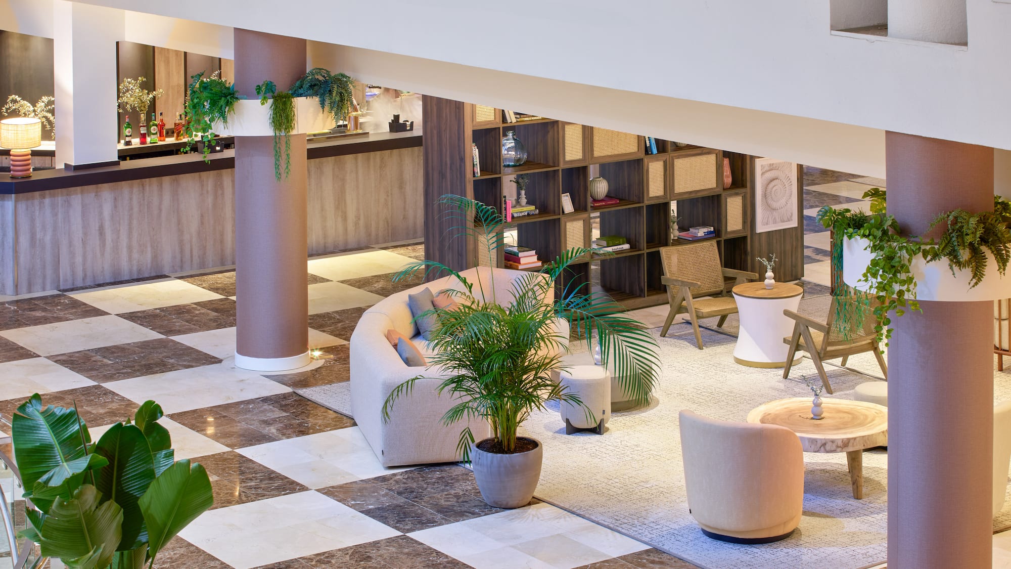 a room with a checkered floor and a couch and tables