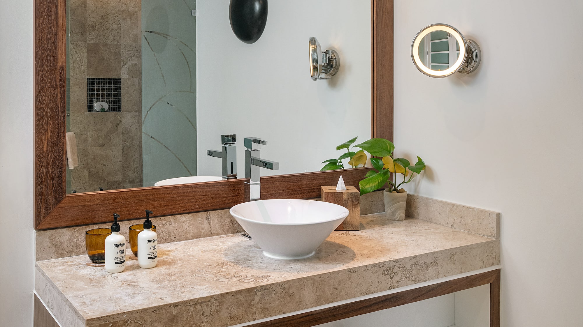 a bathroom with a mirror and sink