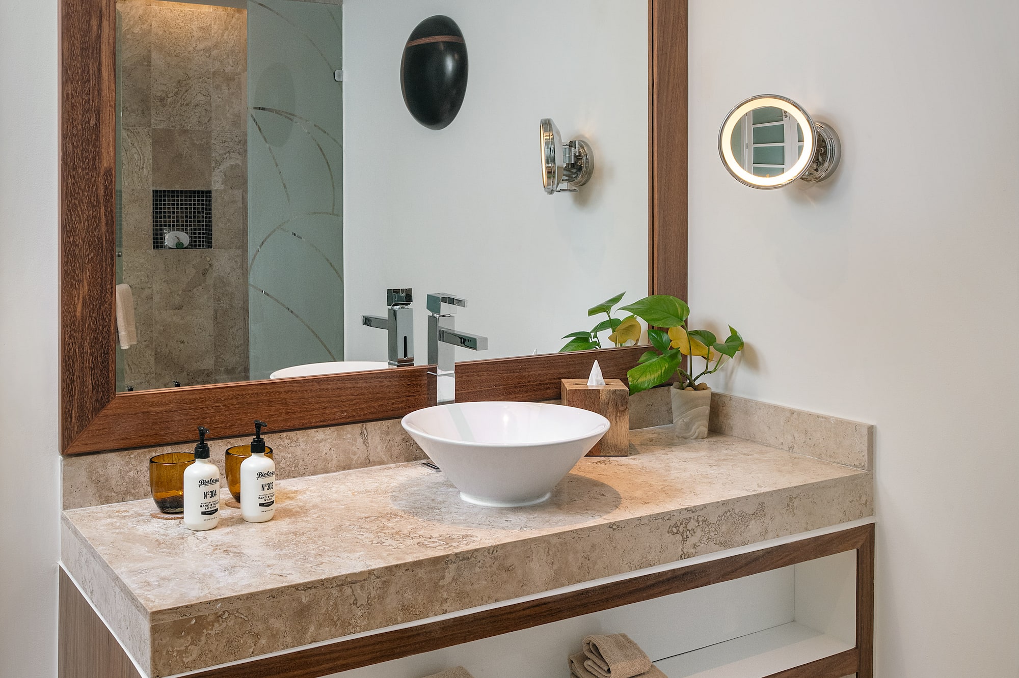 a bathroom with a mirror and sink