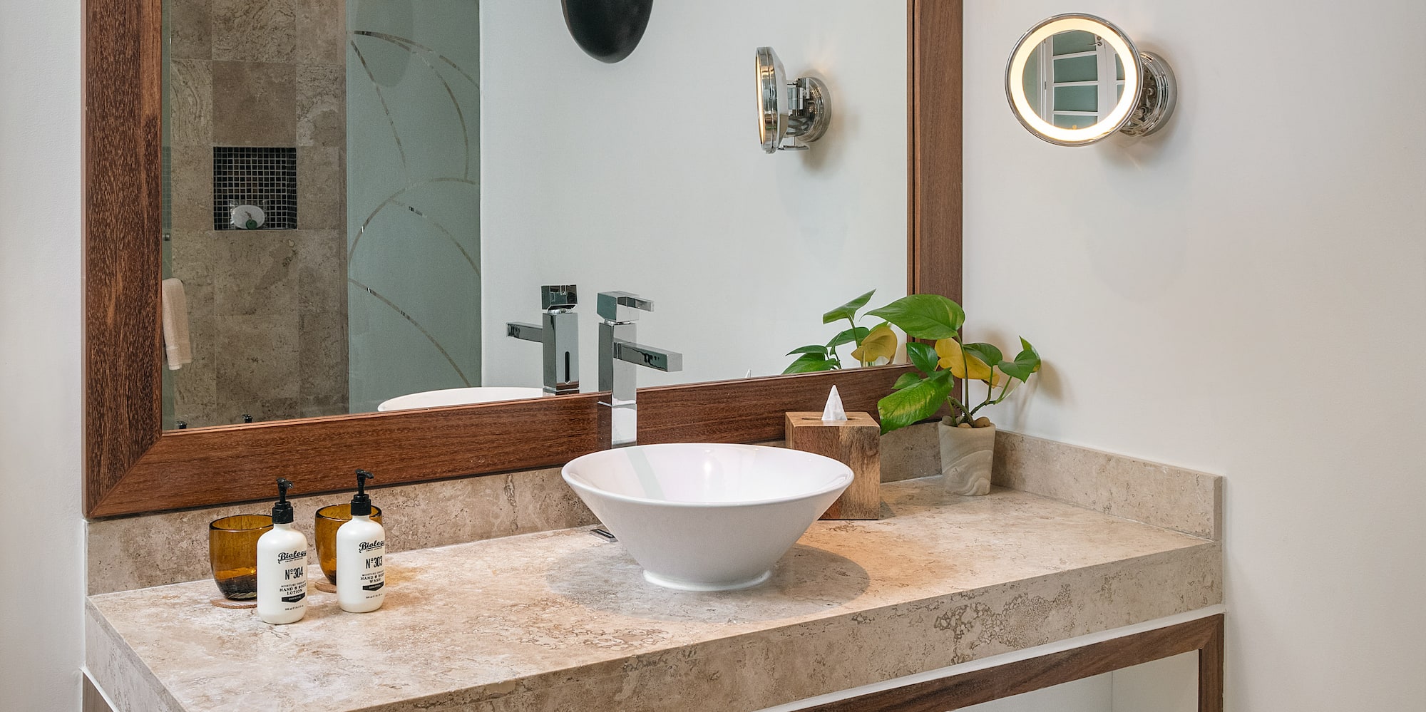 a bathroom with a mirror and sink