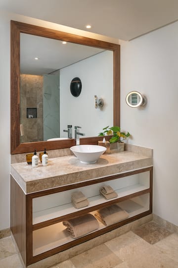 a bathroom with a mirror and sink