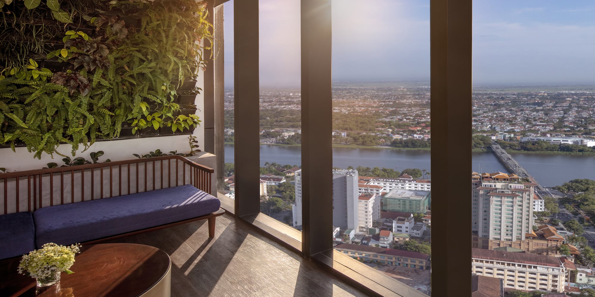 a room with a bench and a plant on the wall
