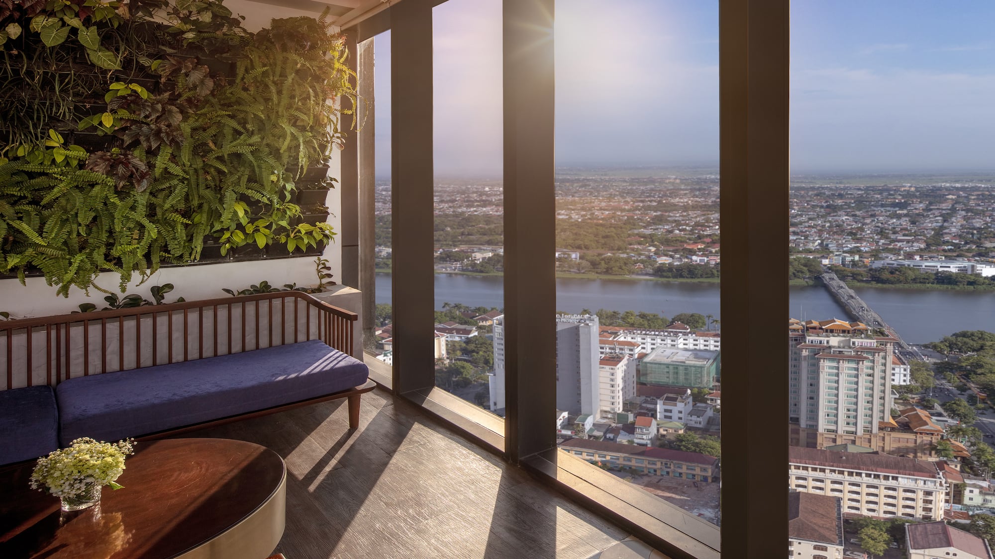 a room with a bench and a plant on the wall