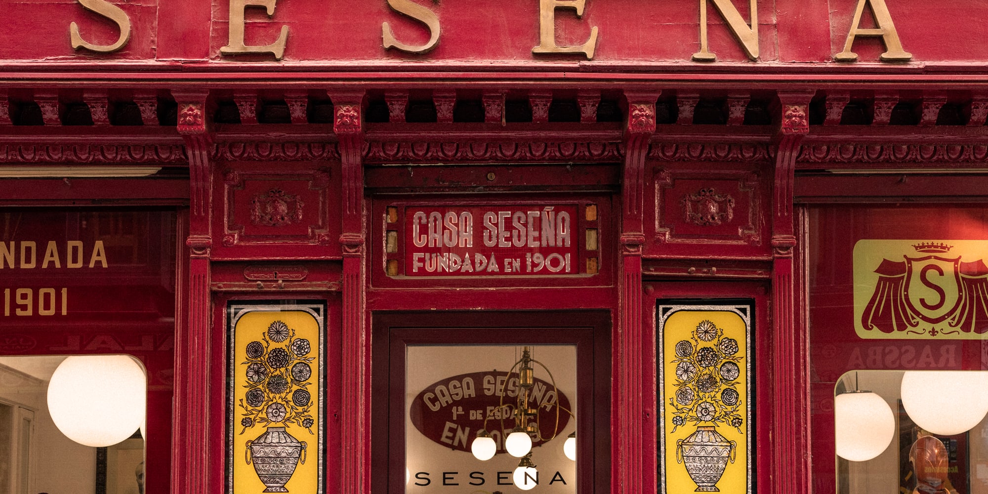 a red store front with yellow and red signs
