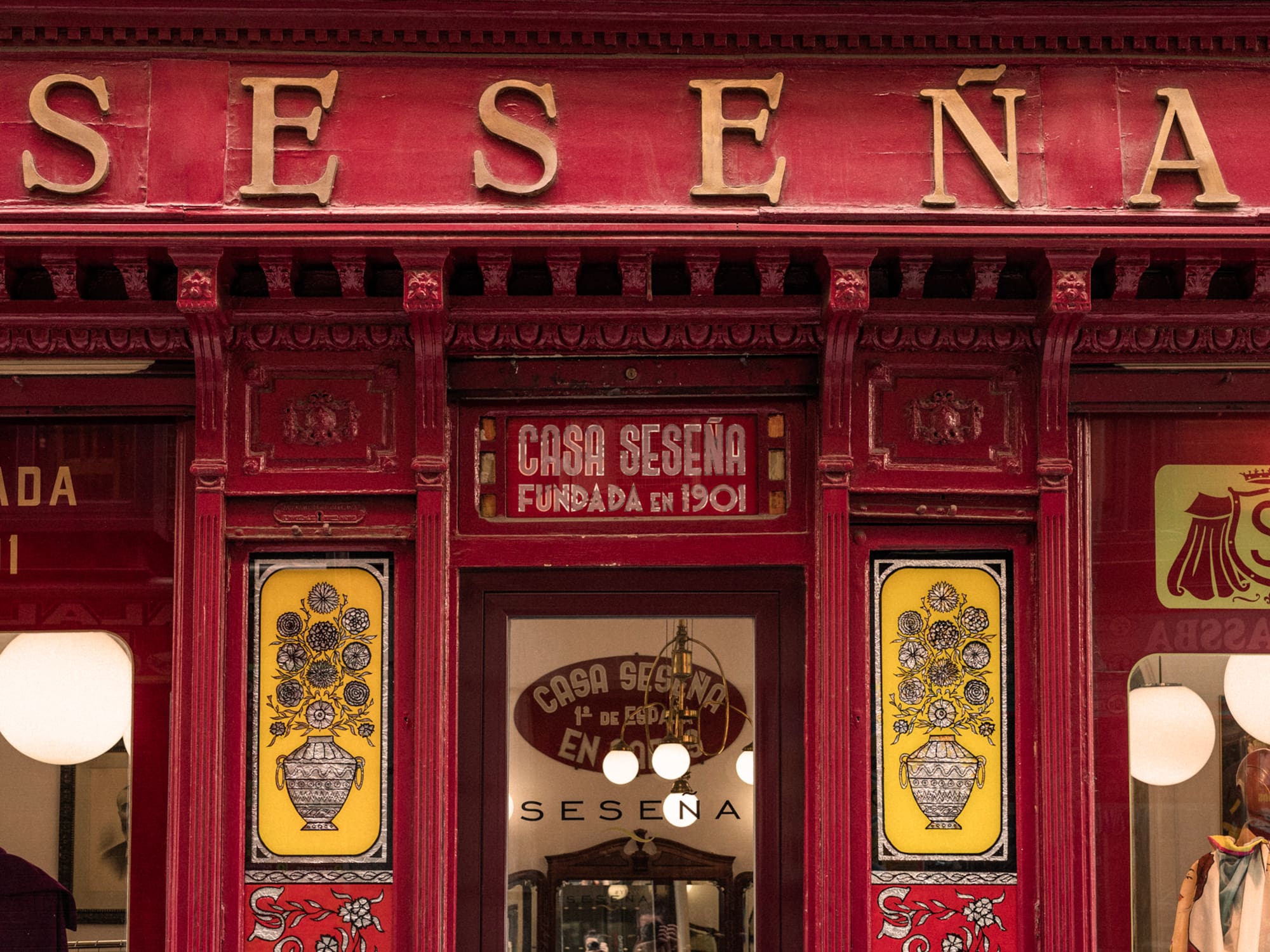 a red store front with yellow and red signs