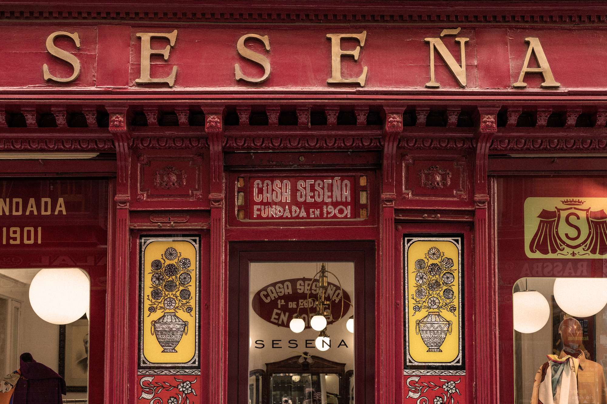 a red store front with yellow and red signs