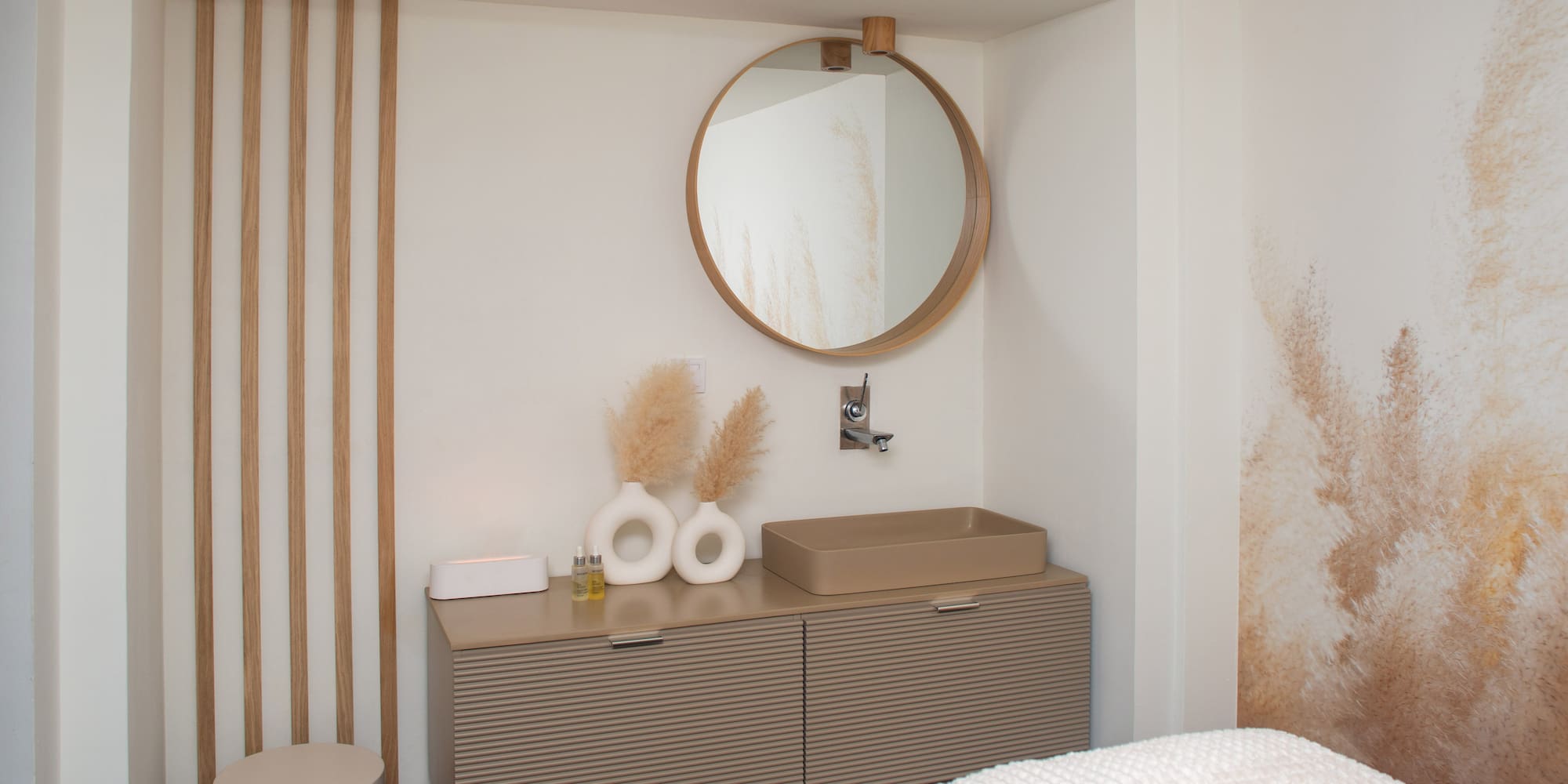 a bathroom with a mirror and sink