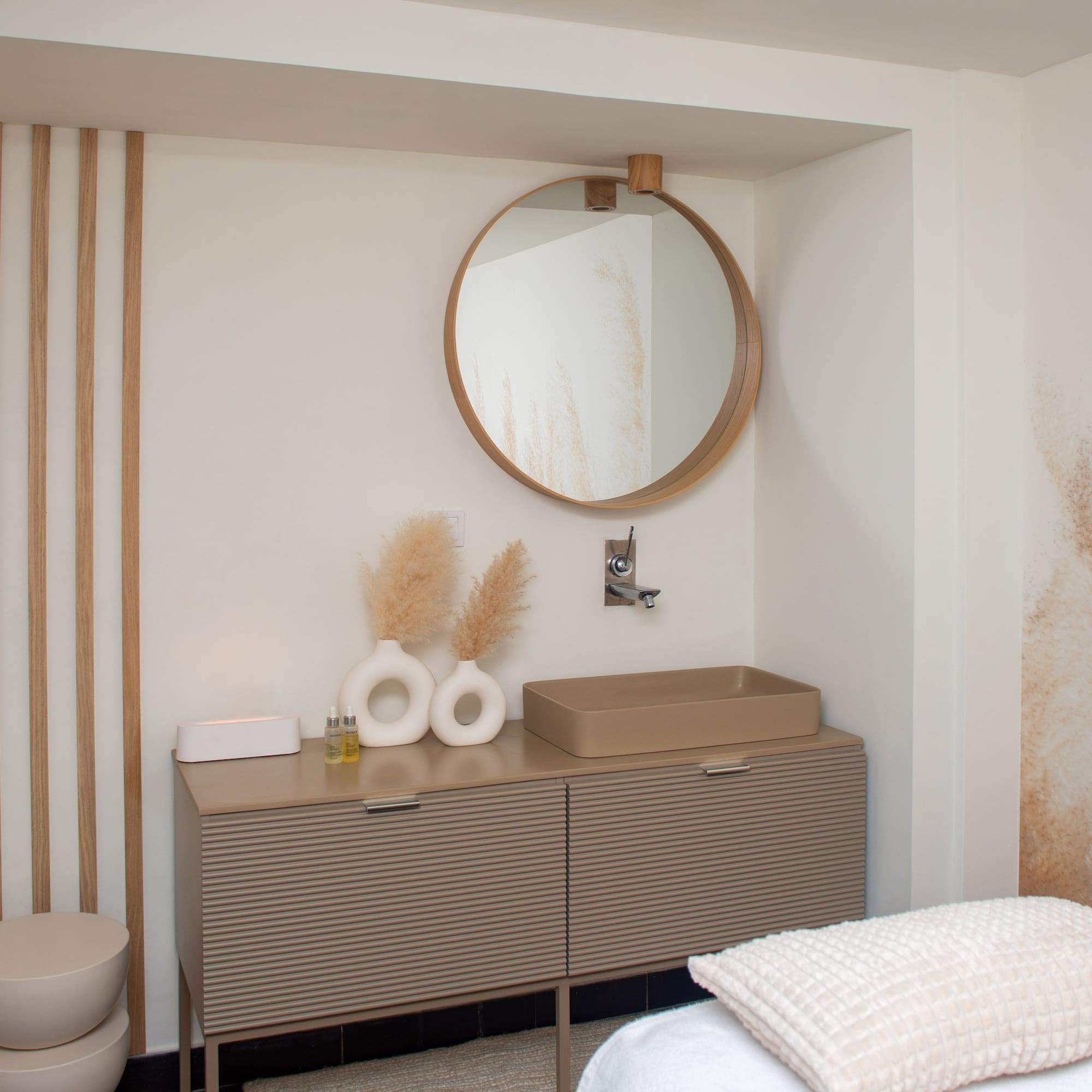 a bathroom with a mirror and sink