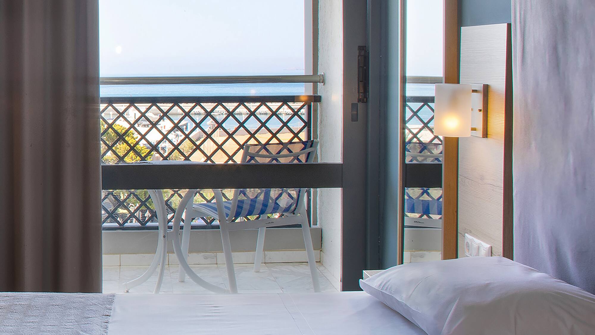 a room with a balcony and a bed