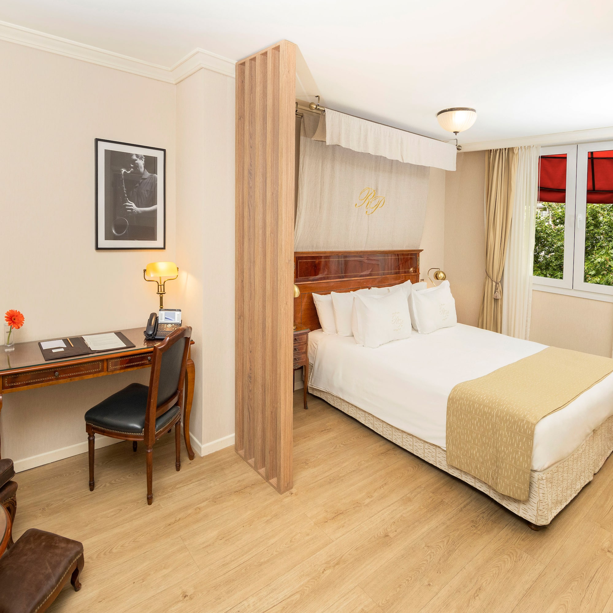 a room with a bed and a desk