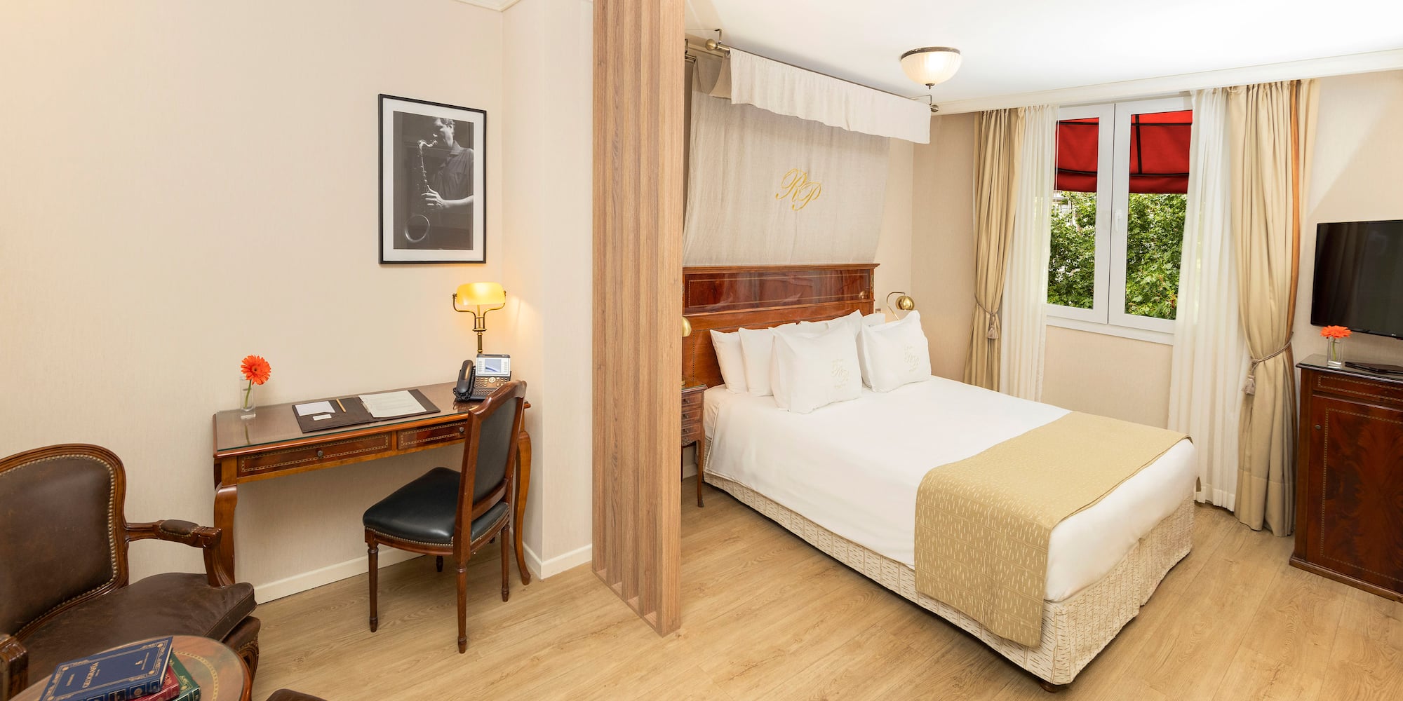 a room with a bed and a desk