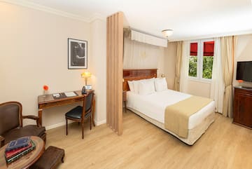 a room with a bed and a desk