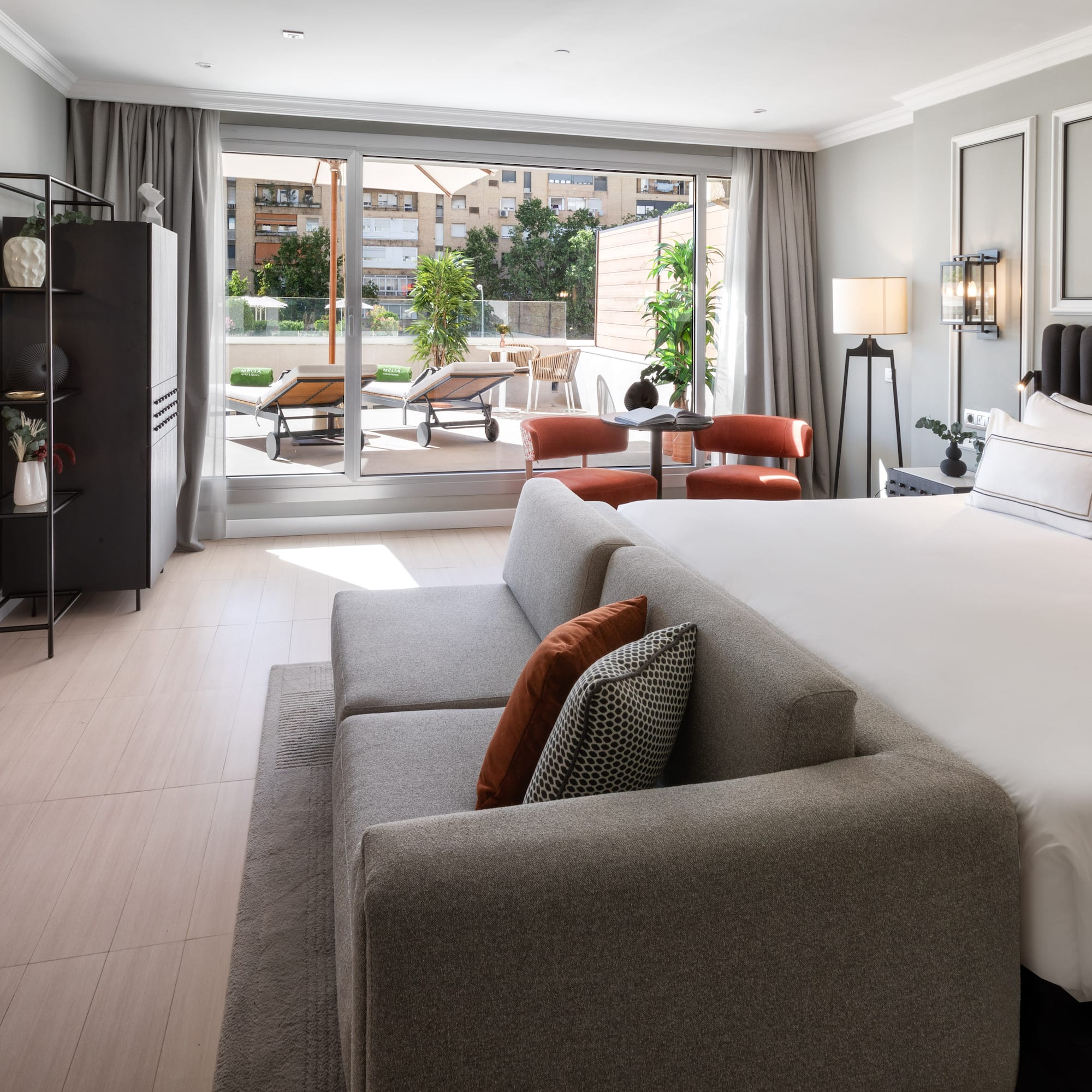 a bedroom with a large bed and a couch