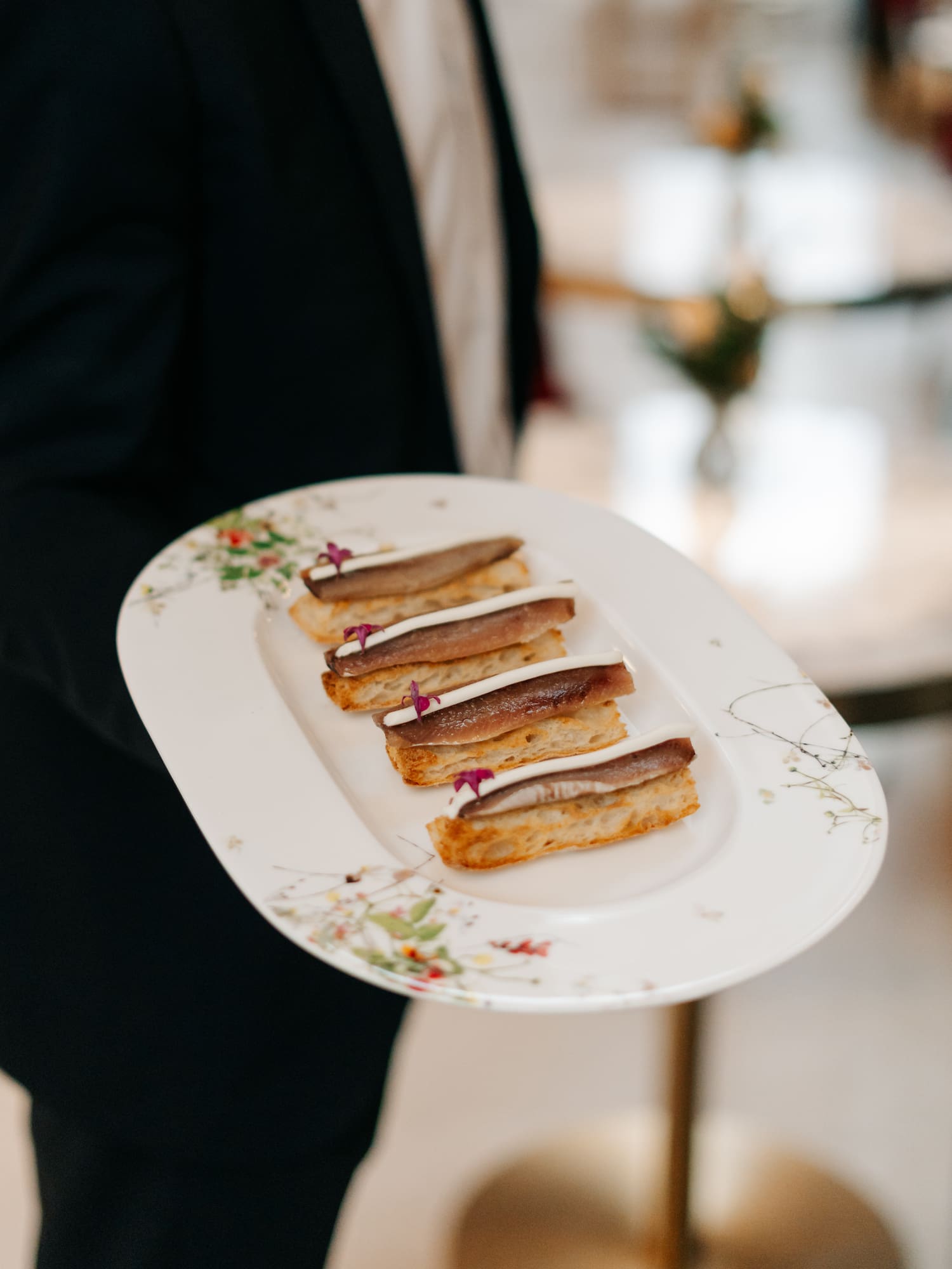 a person holding a plate of food