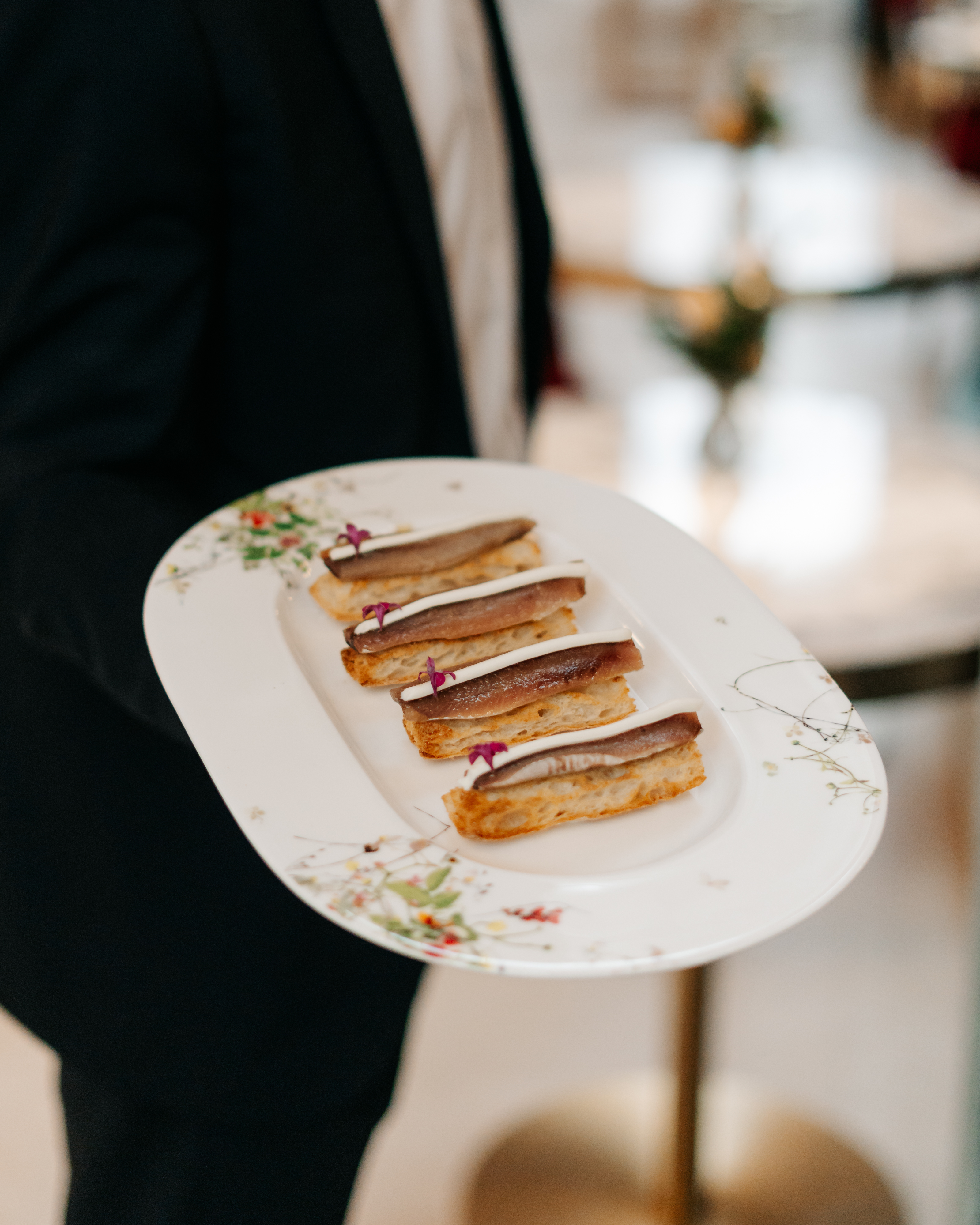 a person holding a plate of food