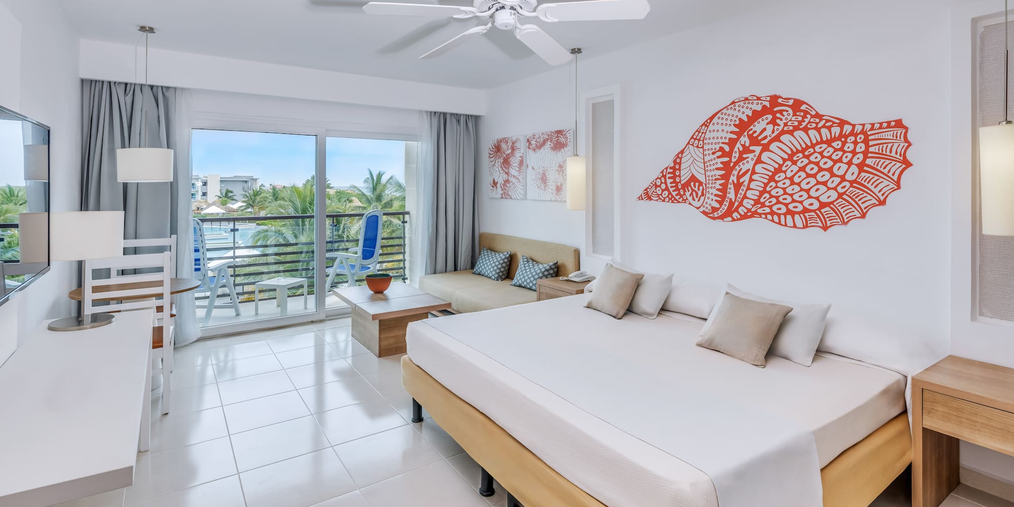 a room with a bed and a ceiling fan