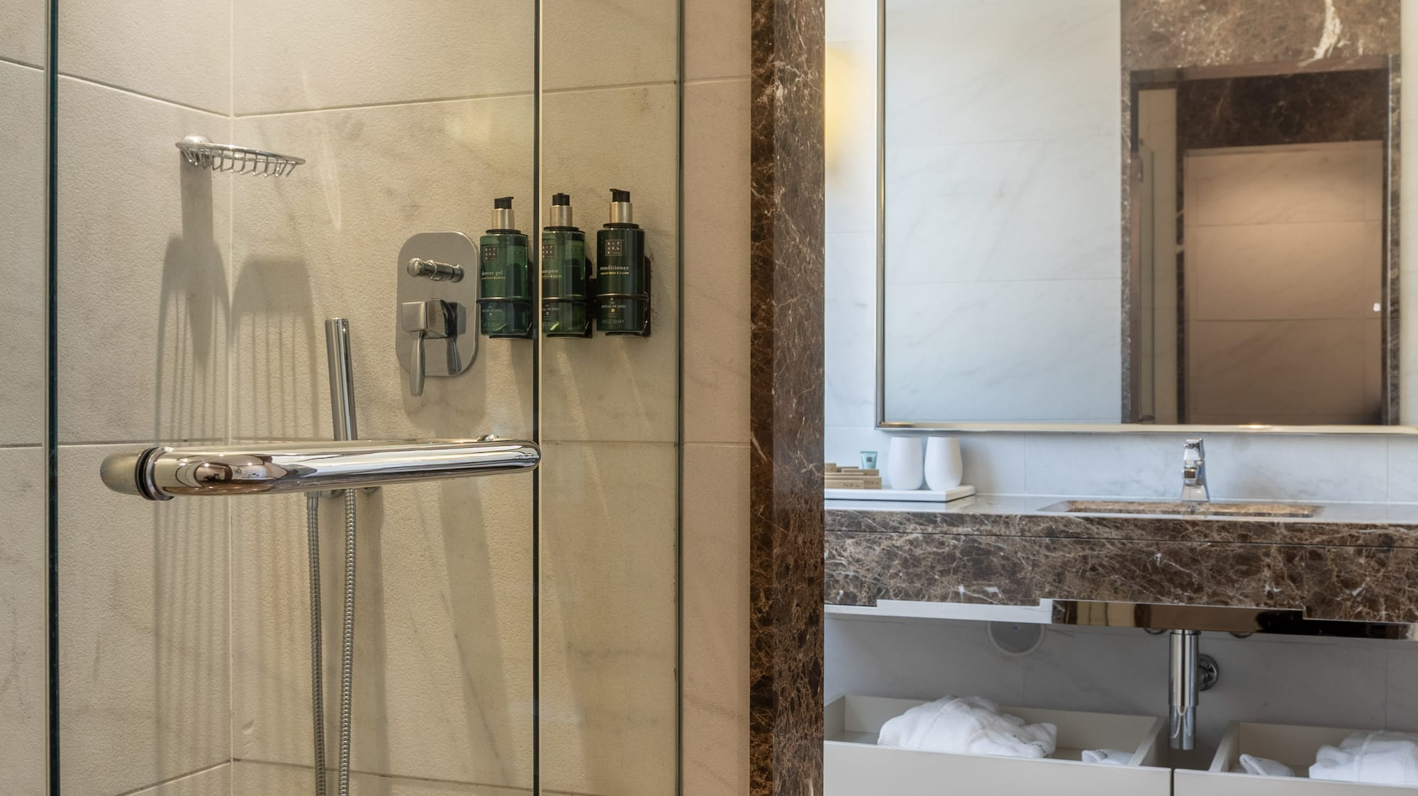 a bathroom with a glass shower door