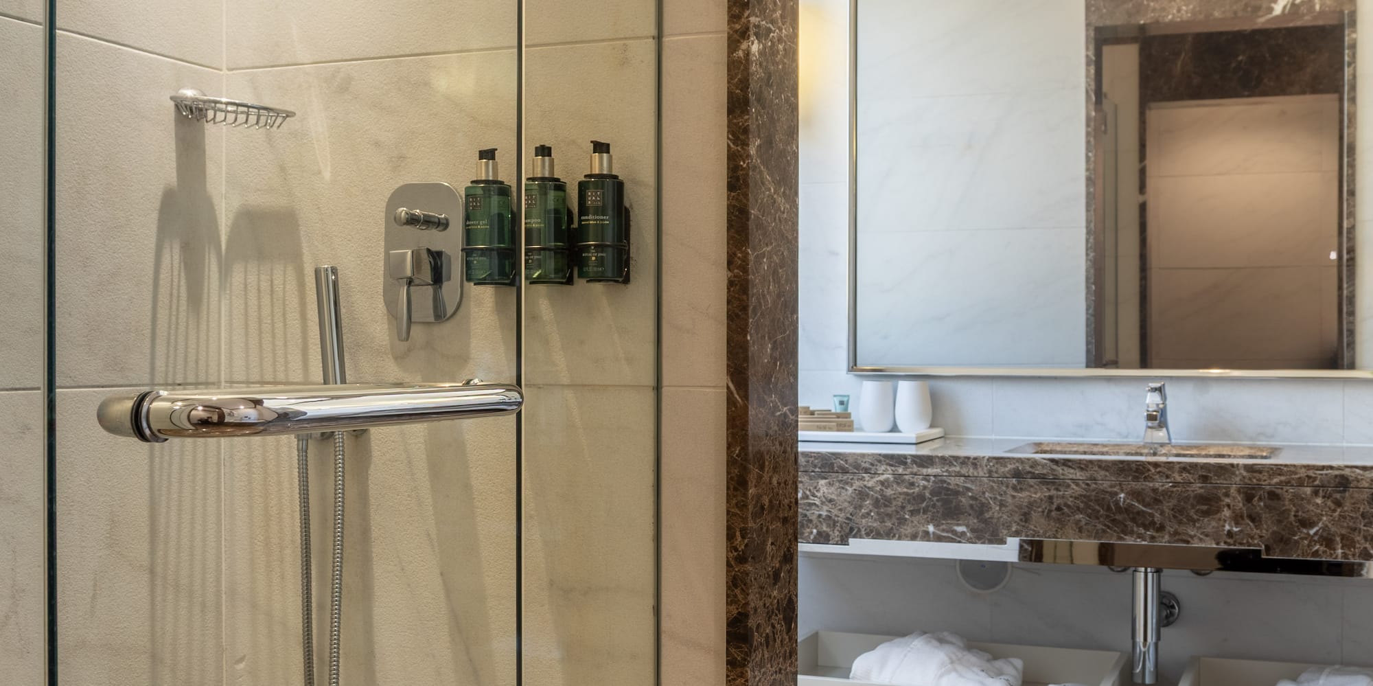 a bathroom with a glass shower door