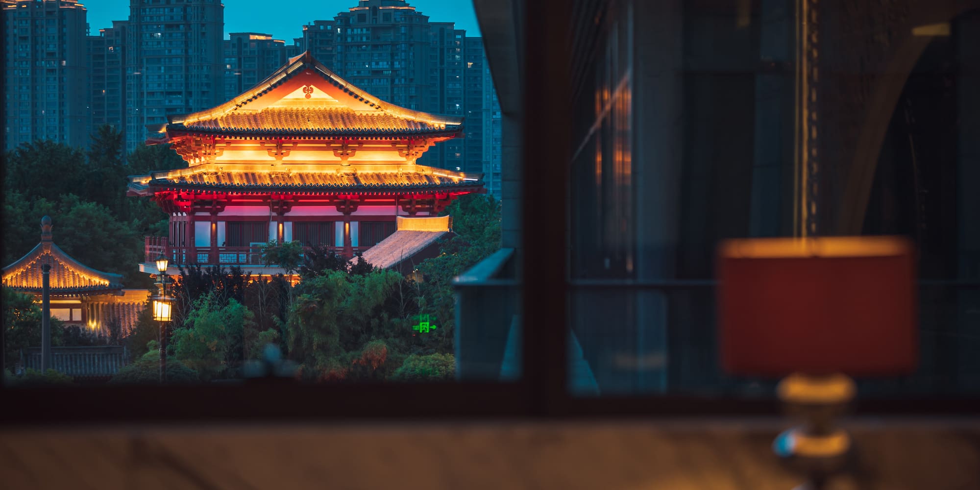 a building with a tall building in the background