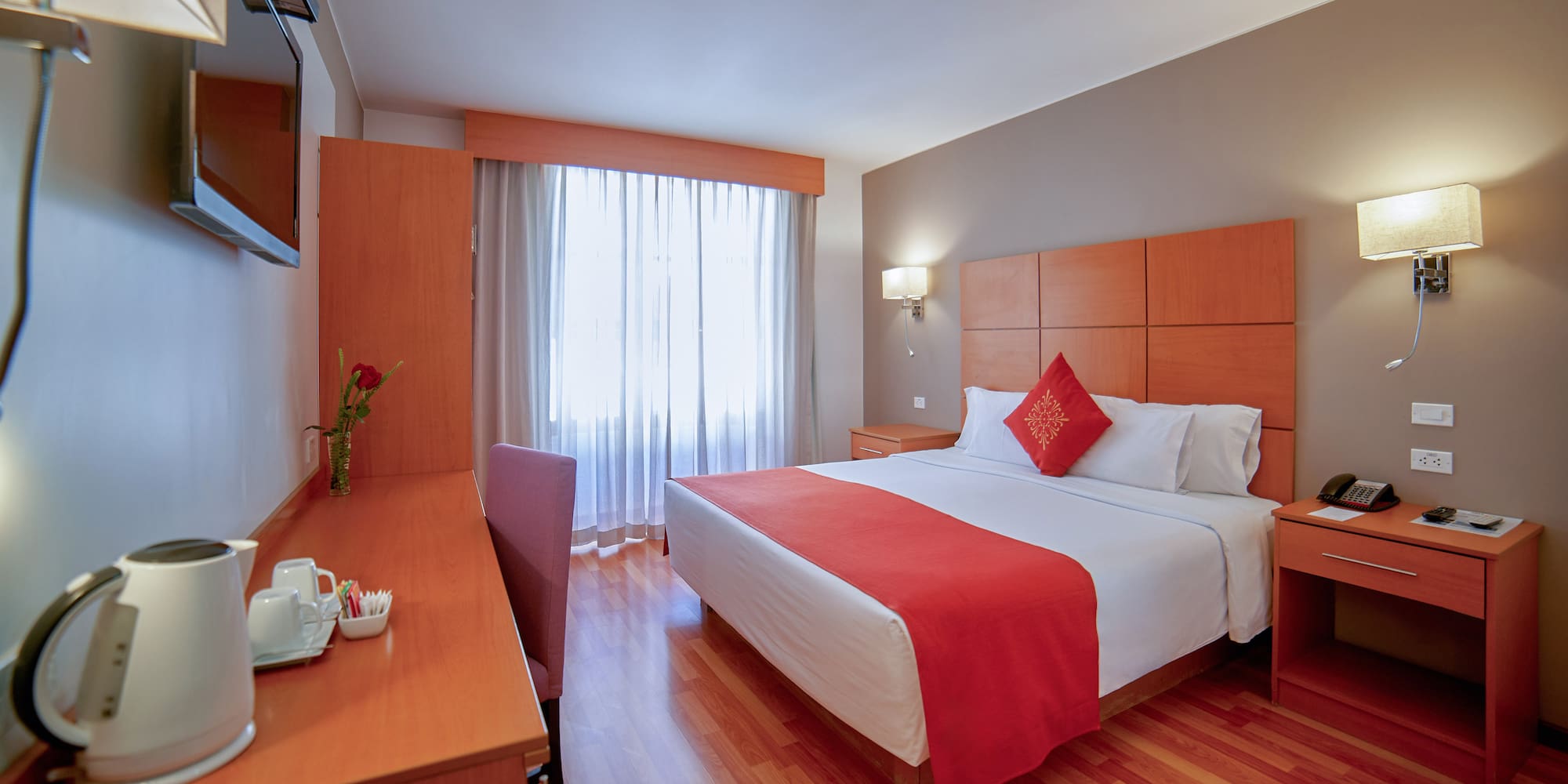 a room with a bed and a desk