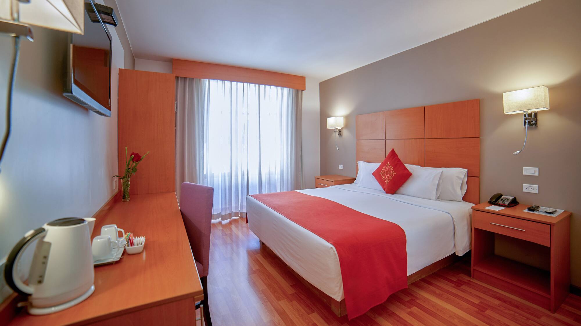 a room with a bed and a desk